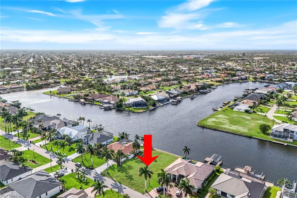 Your ultimate waterfront lifestyle awaits. Positioned on a prime *SOUTHERN EXPOSURE INTERSECTING CANAL*, this exceptional gulf-access lot offers breathtaking, long-water views down the canals, making it the ultimate backdrop for your custom dream home. Located in a highly desirable and beautiful neighborhood known for its stunning contemporary homes, this property checks all the boxes!  Boaters will appreciate the peace of mind and savings that come with a newer, high-quality seawall already in place, and that all utility assessments are fully paid!  Bring your builder, design your custom dock, and start living the luxury waterfront life you’ve always envisioned!