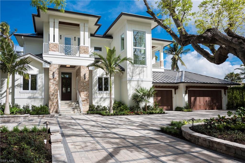 MOTIVATED SELLER!!!  A masterful design and coastal living style are uniquely embodied in this 4 bedroom plus den 5 bathroom home in highly sought after Aqualane Shores.  The home is located on a quiet and tranquil avenue with a canopy of mature Mahogany trees.  There is a boat dock located in the backyard on Duck Channel giving the Buyer direct access to Naples Bay and the Gulf of Mexico via Gordon Pass.  BRAND NEW sea wall with over 100 ft of canal frontage! There is a short .4 mile walk to the 18th Avenue South beach with a shower, .5 mile walk to shopping and dining on 3rd Street South, and a quick 1.2 mile bike ride to 5th Avenue  South.  The house is also located just blocks from the Historic Naples Pier and Palm Cottage.  This house is marketed exclusively by RMC REALTY INTERNATIONAL, built by award-winning custom home builder BUILD, LLC, designed by award-winning Don Stevenson Design/Lotus Architecture.  View the virtual tour and call us for design plans.
