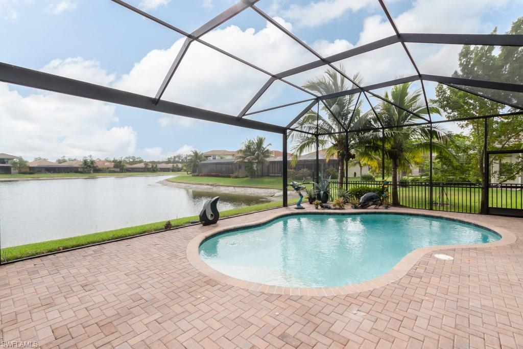 Enjoy superb expansive lake views from highly sought after Carlyle model with pool & large outdoor granite-topped kitchen with built-in BBQ, frig & wet bar. Enter thru double glass doors into a grand foyer with custom tile flooring & tray ceilings. Step[ into a huge great room with custom built-ins, a beautiful gourmet kitchen with gorgeous center Island, separate dining rm with custom moldings, 3 bdrms including a large master suite with beautiful end suite bath, 2 additional full baths as well as a pool bath. A large club room with custom built-ins & a separate laundry rm complete this beautiful home. Located in a luxury gated resort community for all ages, Riverstone, offers unparalleled amenities including a state-of-the-art lifestyle complex w/heated resort-style & lap pools, water play area, indoor basketball/pickle ball court, fully-equipped fitness center w/yoga studio, social room w/catering kitchen and covered patio, outdoor basketball court, tennis courts, playground w/picnic pavilion, & gatehouse with 24/7 security guard. All this & only 10 minutes to gorgeous gulf beaches. Capital contribution for new buyer to HOA $850.00