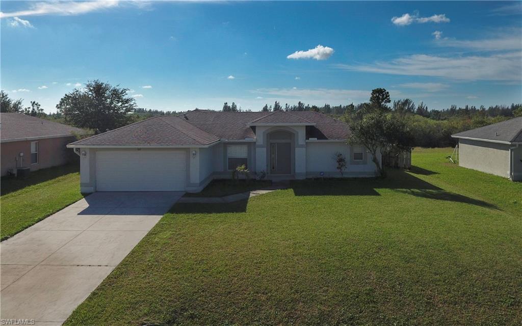 Very well maintained three bedroom two bath home located in a very well kept neighborhood in Lehigh acres. The home is located on Kings canal and offers 6 foot privacy fence. All the well equipment was replaced by the seller.  The seller used it as a vacation home. This home is a split bedroom floor plan with a screened in patio. Set up your private showing with your Realtor.
