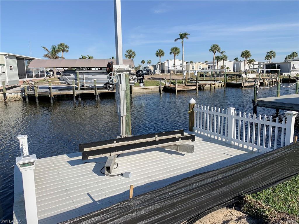 Delight in the beautiful morning sunrises from your own canal-front property. This Direct Gulf Access lot is on one of the widest canals in the community! Build your new dream home in paradise, close to all that SW Florida has to offer! Lot includes a composite dock and jet-ski lift to enjoy inter-coastal and open water fun in minutes! Bayside Estates, is a highly desirable boating community, close to beaches, restaurants and more! 3 miles to Margaritaville Beach Resort, 8 miles to Sanibel Island. Take the trolley down to the beach, restaurants, and other local attractions. Bayside Estates is a 55+, manufactured and modular home community with so many activities to choose from. Approximate Lot size 51’Fx88’Rx88’Lx50’B via Lee County Appraiser. Buyers in Bayside pay a $2800 resale capital contribution fee.