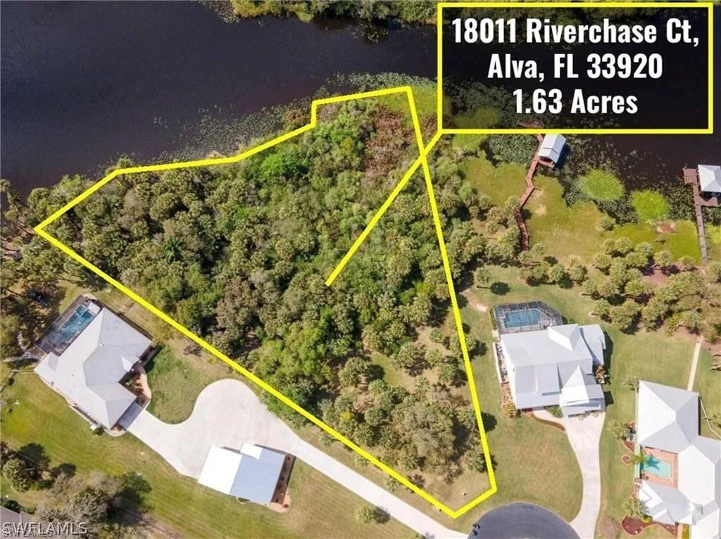 Rare opportunity in Riverwind Cove! This riverfront lot boasts approximately 300 ft of Caloosahatchee River frontage and includes full architectural and engineering plans ready to submit, saving time and expense for the buyer. The plans are for a 2,715 SF two-story home featuring 3 bedrooms, 2.5 baths, open living areas, an in-ground pool, 2-car garage, and dock with lift. Proposed well and septic locations are shown on the site plan based on the current home design. Underground electric is available in the area, with a nearby utility box. Nestled on a private cul-de-sac with sweeping waterfront views, this lot offers the perfect balance of tranquility and convenience—just minutes from schools, shopping, and Downtown Fort Myers. Build your dream waterfront retreat and enjoy the lifestyle Alva is known for!