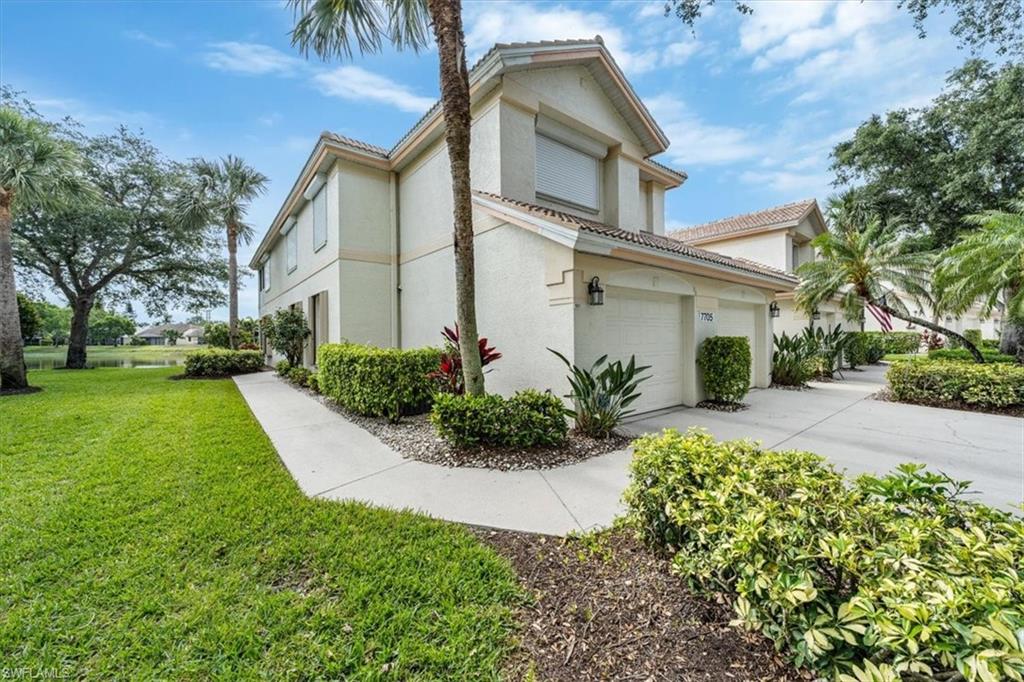 Enjoy morning coffee on the expansive, screened lanai with disappearing sliders as you watch the sun rise over the stunning lake view in your turnkey, newly furnished coach home. This spacious corner unit is light and bright featuring two bedrooms, a den, and two bathrooms along with an attached garage. The Orchards convenient Vanderbilt Beach Road location is close to tons of shopping, restaurants, entertainment venues, golfing at the Ritz Carlton and is less than four miles to our renowned white-sand beaches. This amenity-rich community has two heated pools, lighted tennis courts, basketball, a children's playground, bocce, fitness center and clubhouse. Rest easy knowing hurricane shutters were recently added protecting all the windows and lanai. HOA fees include landscaping, landscape irrigation, water, sewer, cable and high-speed internet! You're only bill is electric! Welcome home! There's nothing to do but unpack!