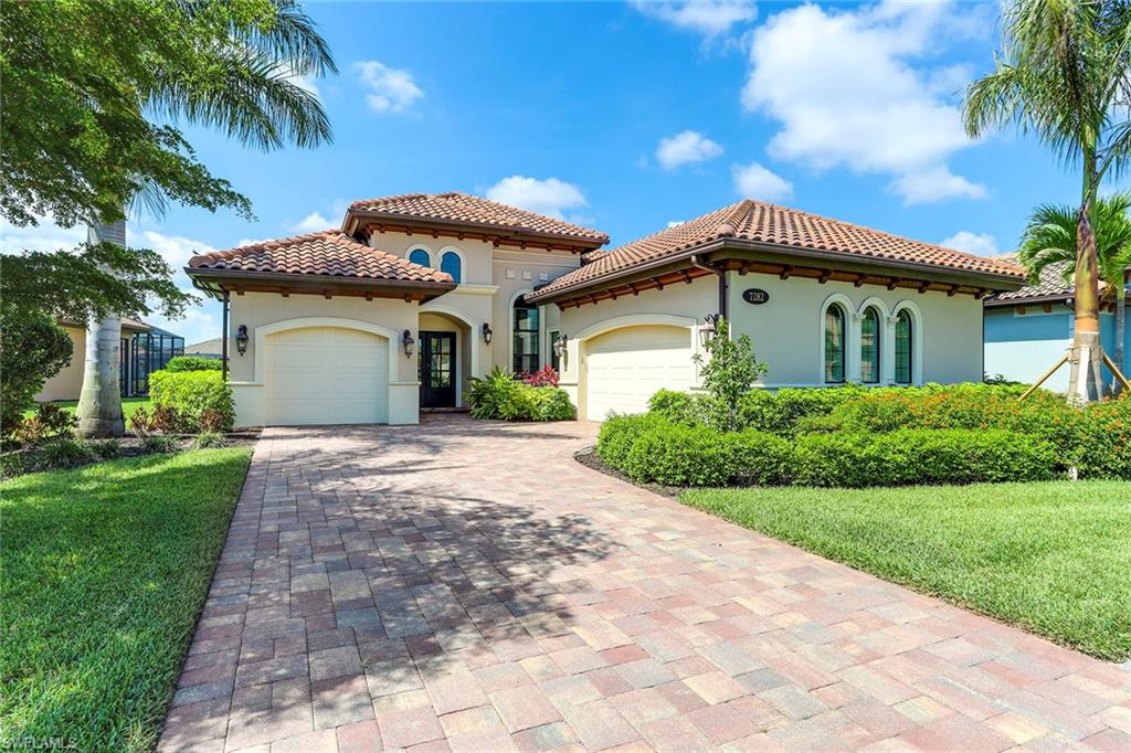 Warm, coastal, chic elegance in this spacious family home. Shows like a model. This stunning home is located on a wide premium lot with southern exposure and tranquil lake views. A short distance to the Olde Cypress Clubhouse. Iron front double-entry doors create a majestic welcome to this popular Jasmine II model with 4 bedrooms and 3 and a half baths. The 4th bedroom and formal dining room are currently used as studies. The Master Suite has a sitting area and two walk-in closets. The perfect home for entertaining family and friends. Fabulous open kitchen with breakfast bar, GE Monogram appliances with ice maker, and wine cooler. Spacious covered lanai with outdoor kitchen and oversized pool and spa. Open concept floor plan with Travertine Stone floors, high ceilings, crown molding throughout, surround sound, and hurricane impact windows. Olde Cypress has a PB Dye designed golf course. Golf membership is optional. Private golf carts are allowed. The Social membership includes tennis, pickleball, and dining in the recently updated clubhouse. Enjoy all the amenities of Country Club living, a short drive from downtown Naples and the sugar-sand beaches of Florida's Gulf Coast.