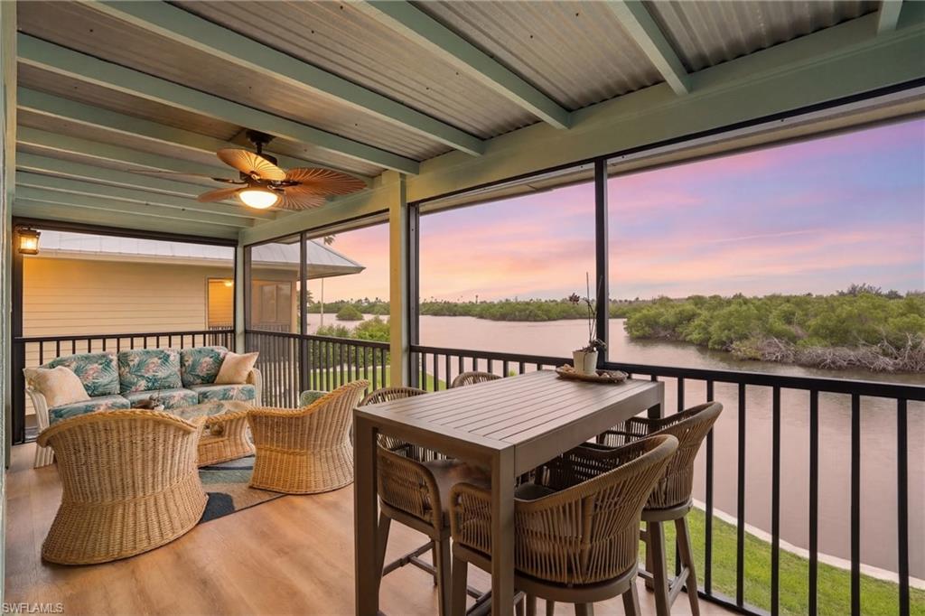 Waterfront living, private dock, boat lift, and direct access to world-class fishing—this is the Pine Island lifestyle buyers dream about.

Located in the exclusive Marina Gardens community in Bokeelia, with only 17 residences, this beautifully updated waterfront condo offers the perfect combination of boating convenience, natural beauty, and low-maintenance living.

Step outside to your private dock equipped with a 10,000 lb boat lift, water, and electric. Within minutes, you'll be cruising the open waters of Charlotte Harbor, exploring Jug Creek, fishing some of Southwest Florida's most productive waters, or heading out for a sunset cruise.

Inside, the home is move-in ready with numerous recent improvements, including hurricane shutters, a completely renovated screened lanai with new framing, screens, and flooring, resurfaced and waterproofed balconies, new patio, skylight, water heater, and more. Every upgrade has been thoughtfully completed so you can spend less time maintaining and more time enjoying the waterfront lifestyle.

The setting is truly special. Relax on your screened lanai, upstairs balcony, or waterfront patio while watching dolphins, manatees, ospreys, and pelicans pass by. Surrounded by mangroves and water views, you'll experience the peaceful side of Southwest Florida that is becoming increasingly difficult to find.

Residents enjoy a beautifully maintained waterfront pool and pool house, while the HOA covers flood insurance, exterior maintenance, landscaping, seawall, docks, boat ramps, septic system, and road maintenance—providing exceptional value and peace of mind.

Whether you're searching for a full-time residence, seasonal getaway, or boating retreat, opportunities like this are rare. Private dock. Boat lift. Direct water access. Island living at its best.

Price recently improved—schedule your private showing today.