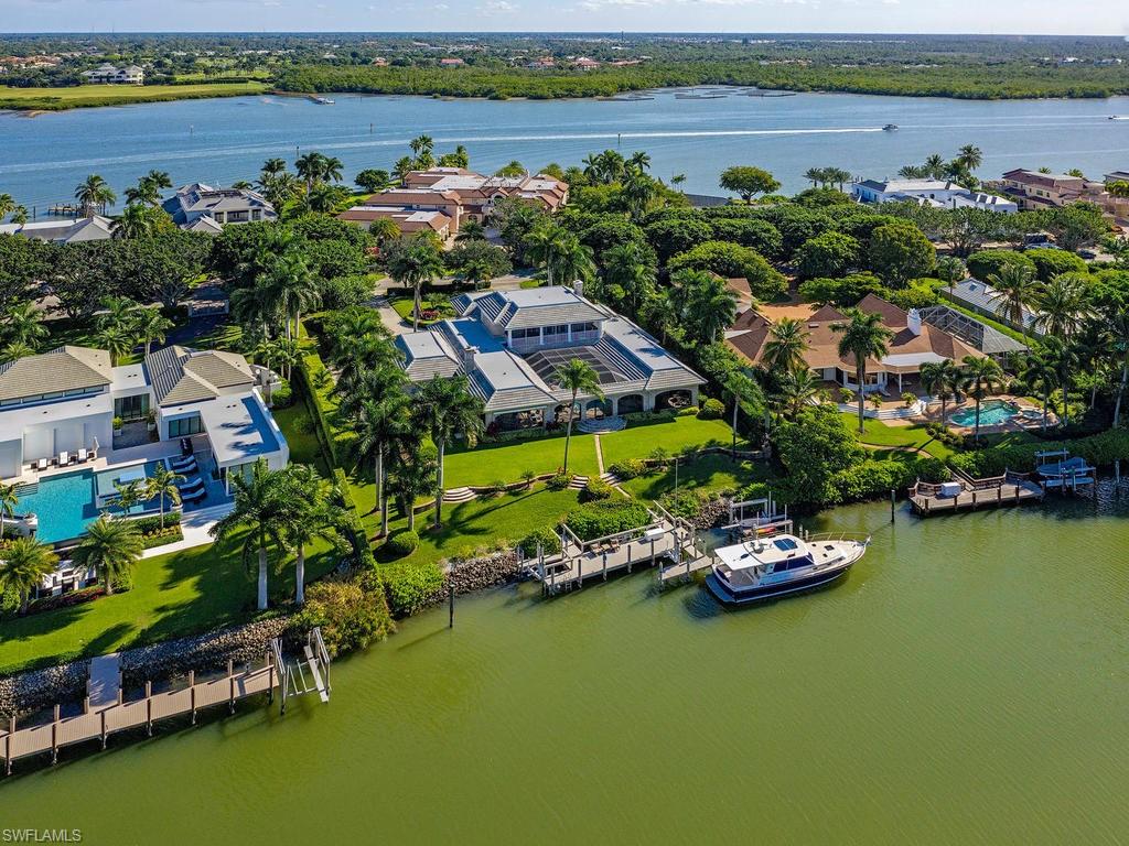 Enjoy beautiful Sunsets and direct gulf access from this rarely available, western exposure, 1.5 lot estate home in Port Royal. This beautifully maintained home sits on .96 acres and offers 6 bedrooms, 6 baths, a completely renovated kitchen, new roof, elevator, attached guest/maids quarters, and multiple outdoor living areas. Designed for accommodating a large family or multiple guests in total comfort, everyone will feel at ease in this spacious retreat. Panoramic Western Views, a 75’ well equipped boat dock, and immediate Port Royal Club eligibility only add to this incredible opportunity.