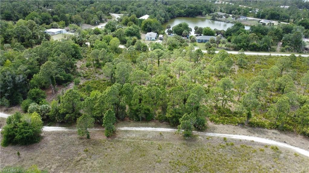 PRICED TO SELL in Tropical Gulf Acres! This vacant lot is your opportunity to build in a peaceful, wooded setting while staying close to everything you need. Whether you're planning your forever home or securing a smart land investment, this property delivers the perfect balance of privacy and convenience. What makes this even more compelling is the adjacent lot is also available for purchase. Buy both and you'll own over half an acre of land, giving you more space, more privacy, or a stronger investment position. Opportunities to control that much land in one move are rare in this area. Located right off Tucker's Grade, you're less than five minutes to I-75 and just a short drive to US-41, putting the shopping, dining, and waterfront lifestyle of Punta Gorda within easy reach. Zoned RSF-3.5 for single-family residential use and situated in flood zone D. Opportunities like this don't come around often. Act fast before it's gone.