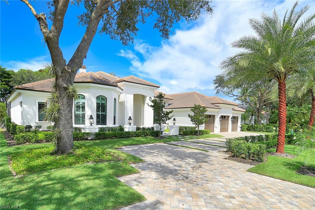 Just completed! Total renovation with the highest quality of materials, located in the Vineyards, with unbelievable west-facing views of the golf course. The exterior includes new hurricane windows and doors, newer tile roof, new landscaping with zoysia grass, new lighting, paver and grass driveway, renovated pool and spa, new screen picture window, new patio, putting green and a 500-gallon underground propane tank which is set up for a generator. The interior is completely redesigned with new flooring, remodeled baths with Toto plumbing fixtures, new interior doors with high-end door hardware, new millwork in every room, custom closets throughout, enlarged pantry and laundry room with two washers and two dryers, remodeled kitchen with Sub-Zero refrigerator, Wolf gas range, Sub-Zero drawers and a Sub-Zero bar refrigerator and two Bosch dishwashers. The home spans 3,800 square feet under air and 5,176 total square feet with a three-car garage. The primary oversized bedroom includes two primary baths, one with a steam shower and one oversized walk-in shower with two shower heads each with their own custom walk-in closet, four bedrooms with en suites, 5.5 baths plus large den with bay window and media room with new glass steel custom wall with French doors. The large great room includes a meticulously designed kitchen with large island and custom cabinetry, a wet bar, dining area facing the pool and outdoor area, and living area with custom built-in shelving and fireplace. Exquisitely designed for entertaining and everyday living, this home offers a seamless blend of luxury and functionality. The screened lanai features a newly surfaced pool and spa, an outdoor kitchen and two large seating area. Right outside of your pool deck is an additional seating area facing the golf course and your private putting green. The Vineyards is inland in a fabulous location close to everything Naples has to offer and has spent millions of dollars renovating the clubhouse and golf courses. The Vineyards has become one of the finest lifestyles in Naples with a wellness spa, fitness centers, lap pool, large recreation pool with restaurant and bar, pickleball, tennis and bocce ball courts, and two totally renovated championship golf courses, along with casual and fine dining options. This home is in the exclusive neighborhood of Arbor Glen, one of the nicest neighborhoods with only 44 estate homes in the Vineyards with cobblestone street and bridged entranceway, making this home a unique estate for the most discriminating buyer.