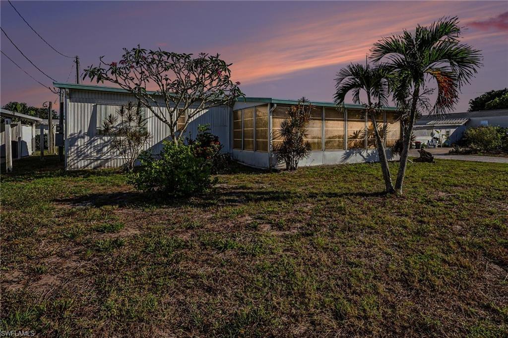 Welcome to 4811 Flamingo Drive in the heart of St. James City—an authentic island escape where the water is your backyard and the lifestyle is all about simplicity, sunshine, and great fishing.
This waterfront-access property has been enjoyed by a true fishing enthusiast, making it the perfect setup for anyone who lives for early mornings on the water and stories that get better with every cast. With direct access to open waters, you can be out to some of the area’s best fishing spots in minutes.
The home itself offers a classic “fishing shack” feel and is ready for its next chapter. It does need updating, but that’s where the opportunity lies. Whether you choose to refresh it, renovate it, or keep it as a laid-back retreat, this property is all about location and lifestyle.
Outside, there’s plenty of potential to create your ideal waterfront setup.  The location currently comes with an older boat house but add a dock, boat lift, and make it your personal basecamp for island adventures.  The large lot size adds value and ample room for trailers and fishing toys. 
Located in the relaxed, golf cart-friendly community of St. James City on Pine Island, this is the kind of place where neighbors wave, sunsets steal the show, and life revolves around the tides.  There is a voluntary HOA that allows access to the community boat ramp and heated pool.  The clubhouse is a great community location with bingo, dances, and games.  
If you’ve been searching for a true Florida fishing getaway with room to make it your own, this is it. Bring your vision, your boat, and your love for the water—4811 Flamingo Drive is ready to become your ultimate fishing retreat.