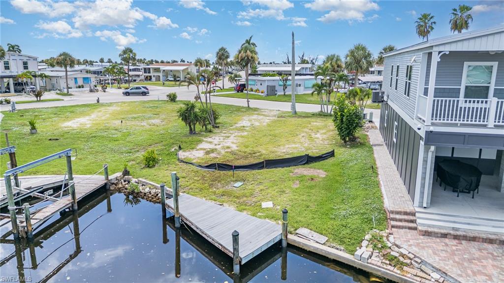 Discover the perfect opportunity to build your coastal retreat on this beautiful vacant lot at 11280 Dogwood Drive in Bayside Estates. Located on the desirable saltwater canal side, this property offers direct Gulf access, ideal for boating enthusiasts and waterfront living. With prime canal frontage, you’ll enjoy tranquil water views and easy entry to open waters, perfect for fishing, kayaking, and other water activities. As part of the Bayside Estates community, you’ll have access to fantastic amenities, including a clubhouse, pool, tennis courts, and various social events. Conveniently situated near shopping, dining, entertainment, and local beaches, this lot offers the chance to design a custom home and embrace the Florida waterfront lifestyle. Don’t miss this rare opportunity to make Bayside Estates your new home!