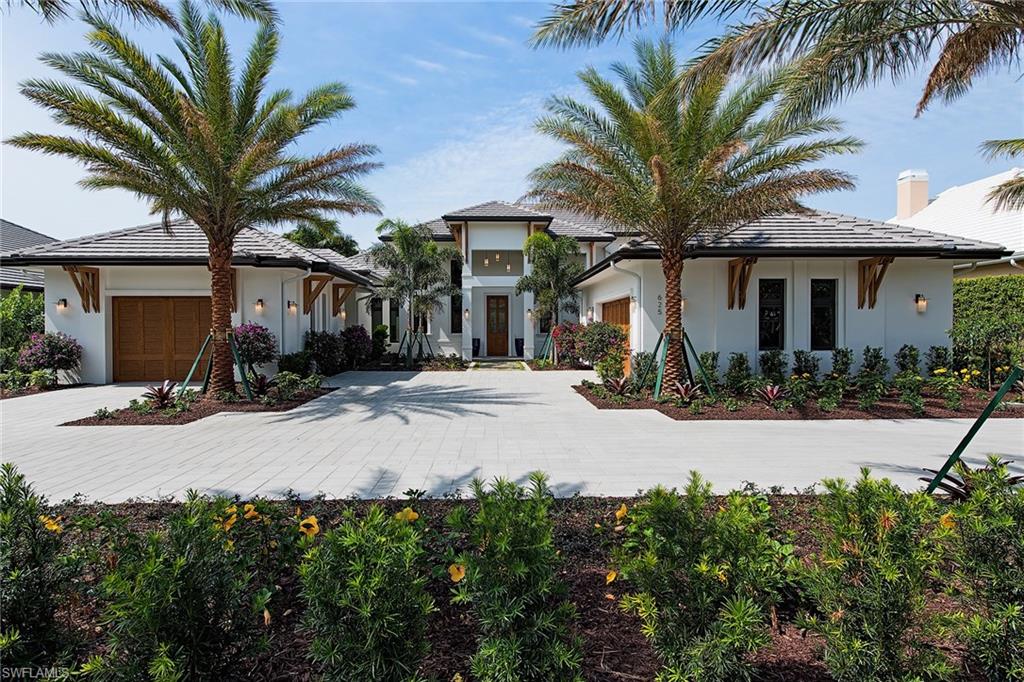 This classic West Indies-style custom residence is sited on an oversized deep lot in the Moorings, close to the downtown area of Old Naples. The 4,600-square-foot home offers elegantly appointed interiors that feature vaulted and coffered ceiling details, wide-plank cerused wood floors, and an artisan-quality finished wine room located just off the great room and kitchen. A resort-style master suite offers privacy, while the three additional guest bedroom suites provide comfort for family and friends. Expansive glass doors throughout open to spectacular grounds that include covered loggias with summer kitchen, a glass waterline tiled pool and infinity-edge spa. This forever home is eligible for the Moorings private beach park, an exclusive beachfront park with parking privileges and convenient access to the beach.
