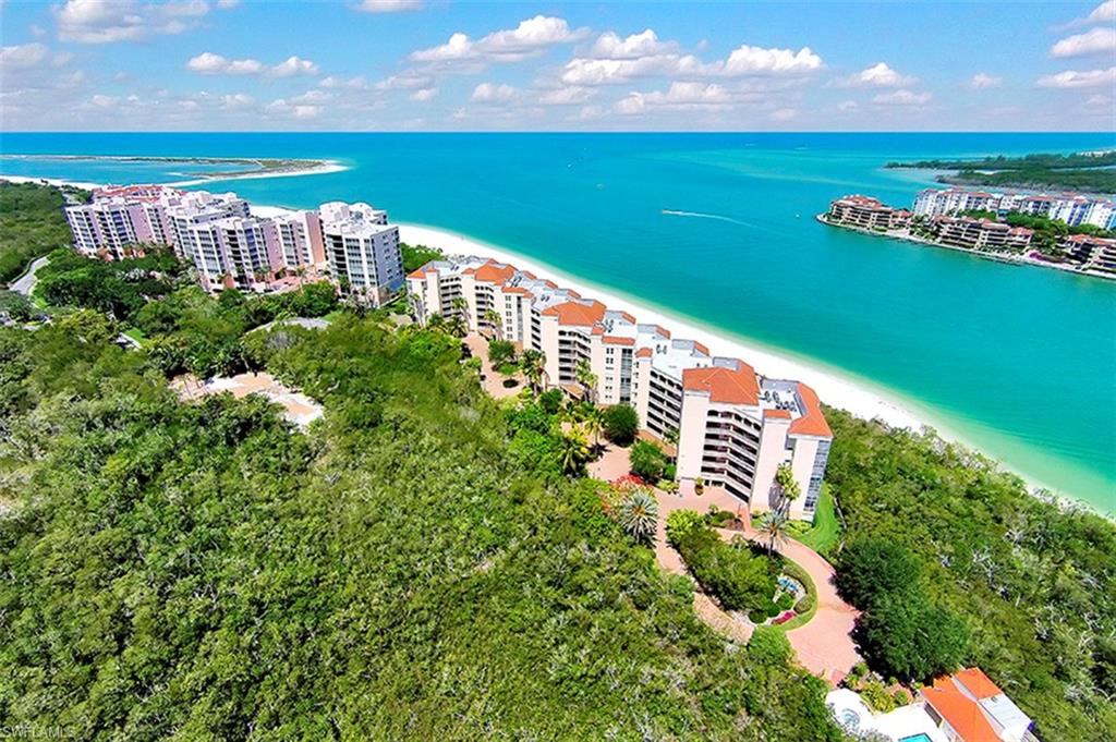 Incredible water views surround this 3 bedroom 2 bath upscale residence that is ideal for watching sail boats pass by from the Marco River into the tranquil waters of the Gulf of Mexico. A perfect blend of airiness, natural wood palette tones and nautical decor design showcase the best of what laid back island luxury has to offer. This unit comes furnished and features a fully upgraded open kitchen with stainless steel appliances and hood range, wet bar, tray ceilings, tile and carpet throughout, laundry room, walk in closet, glassed in lanai with electric shutters. World class amenities for Hideaway Beach include: 24 hour gated entry, a 6,000 square-foot sports center facility, a fitness center, pro shop, steam room, therapeutic room, a gulf front beach club with multiple dining options to satisfy any appetite, Har-Tru tennis courts, a nine-hole executive golf course, a regulation-sized groomed croquet court, ocean view swimming pool and white sandy beaches.