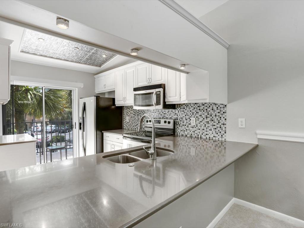 Come see this nicely updated condo in Winterpark. Renovated kitchen and baths, new roof, and newer A/C. The condo offers 2 large bedrooms, 2 bathrooms, large walk in closet in master, and an open floor plan. Kitchen offers stainless steel appliances, quartz counter tops, and a large breakfast bar. Vaulted ceilings, a spacious laundry room with extra storage, custom moldings, upgraded fixtures, an open outdoor patio. The community offers  a large resort style pool, tennis court, pickle-ball courts, running path, and more. Few units come up in this price and with these updates.