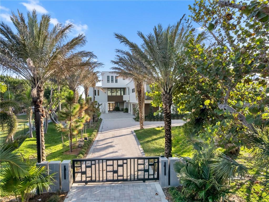 This extraordinary beachfront estate on Sanibel Island is one of the finest ever offered on the Islands. Situated on World Renowned West Gulf Drive with Incredible Sunset Views, this private, gated retreat exemplifies direct beachfront luxury at its finest. Designed by the renowned AJO Joyce Owens Architecture and set for completion in Spring 2025, this modern island residence sets a new benchmark for Island coastal living. Offering 6,073 square feet of air-conditioned living space and a total of 15,671 square feet dedicated to exceptional living. Every detail has been thoughtfully curated from ultra-high-end custom cabinetry, Top Zero sinks in kitchen, Genaire Pro gas oven, exotic countertops, to premium Fleetwood & Euro wall windows and doors that blur the lines between indoor and outdoor living while showcasing breathtaking Gulf Front Sand Beach Sunset Views. The home also features a private elevator to all floors, Hugh Primary Bedroom with uncompromised Beach Front views with outdoor Hot tub, a dedicated home gym, and a full-house 1000 Gallon 60 KW generator, elevating both convenience and peace of mind. Elegant Snow Fly 48X48 Porcelain high-end flooring runs throughout the home, while a state-of-the-art Control4 system provides whole-house automation for lighting, audio, video, security, and climate control, African Pearl Crystal Bar, Mahogany staircase to all floors, built in closets, DXV toilets. Outdoor living is just as exceptional, with a sprawling lanai, resort-style pool, outdoor kitchen, and lushly landscaped grounds creating a private coastal oasis designed for both entertaining and peaceful retreat. With its impeccable craftsmanship, attention to detail, and world-class amenities, this estate rivals the finest homes in all Southeast and Southwest  Florida, bringing that elevated level of luxury to Sanibel Island.