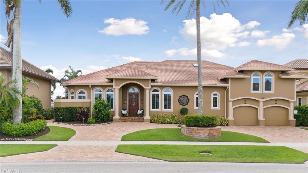 Experience luxurious waterfront living at its finest in a stunning Marco Island custom home. This 4 bedroom, 4 bath, 2-story masterpiece offers direct Gulf of Mexico access, allowing you to indulge in the beauty of the open waters quickly.  Enjoy cooking in the open main kitchen upgraded with Stainless Miele appliances including a built-in convection oven-microwave combination and a built-in steam drawer.  The refrigerator is a Sub-Zero Classic French Door Top with Freezer Drawer below.  First-floor Bedrooms are set up as a Double Master layout on each wing with another split bedroom being used as an office. This home also has a full apartment upstairs, complete with its own kitchen and full bath, providing ample space and privacy for guests or extended family. The coveted Southwestern exposure ensures breathtaking bay views and the opportunity to witness gorgeous sunsets all year round. Take advantage of the pool, spa, and expansive screened lanai, perfect for entertaining. Additional features such as a large Trex-style dock (still under warranty) and 20,000 lb. lift, outdoor kitchen, built-in bar area, and meticulous craftsmanship throughout make this home an exquisite choice for those seeking luxury and comfort. Equipped with a 17 KW generator, this home also ensures peace of mind.  Don't miss out on the ultimate waterfront lifestyle at this luxury Marco Island River Isles home.