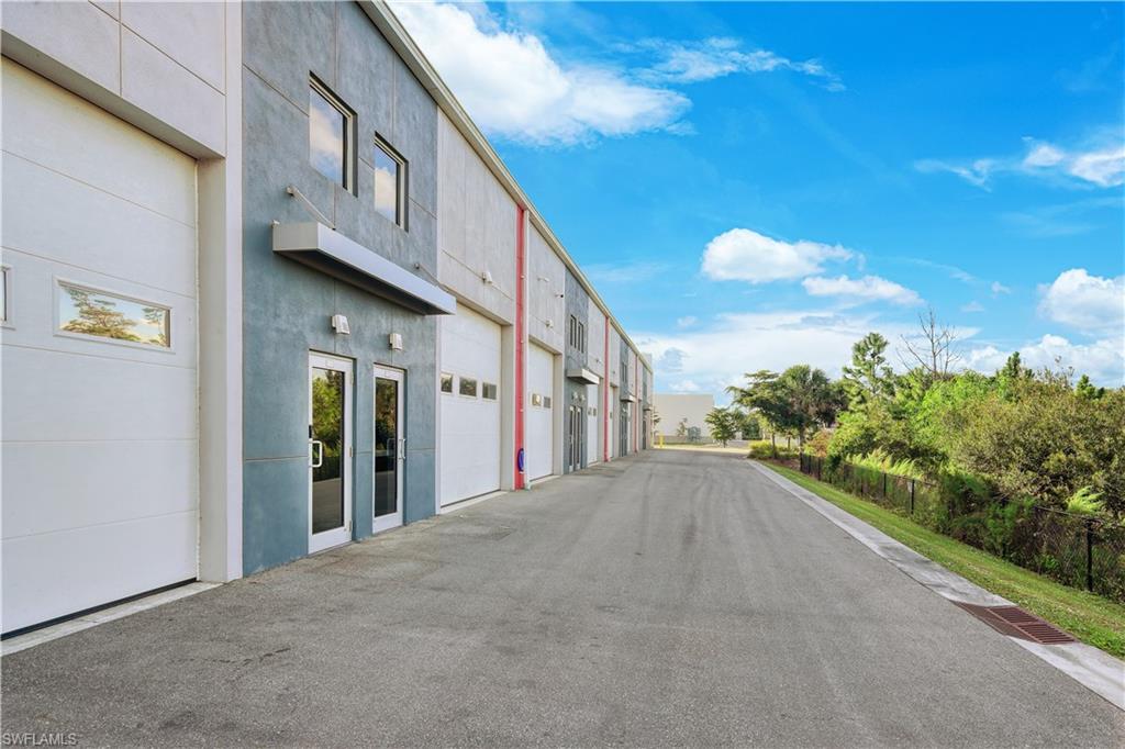 Rare drive through back-to-back double garage condo unit in Alico ITEC Park. 2 conjoined units being sold in this one transaction.  Units 105 and 118. Two motorized auto lifts are included in the sale. This is the ideal location to store your exotic or classic vehicles. Well-lit and equipped with electrical hookups to support a variety of needs, the garage offers 24/7 access and flexibility in a prime Alico Road location. Unit has interior half-bath, and folding glass doors separating the units. This is a must-see for an auto enthusiast.  Commercial sized garage doors on either end of the unit allow for seamless drive through and moving of vehicles. This hard-to-find offering is an exceptional value to own two back-to-back units. Units are  24' x 43.8" and 24'x 28.1" Lee County unit PID's are: 07-46-26-L3-13000.1050 and 07-46-26-L3-13000.1180