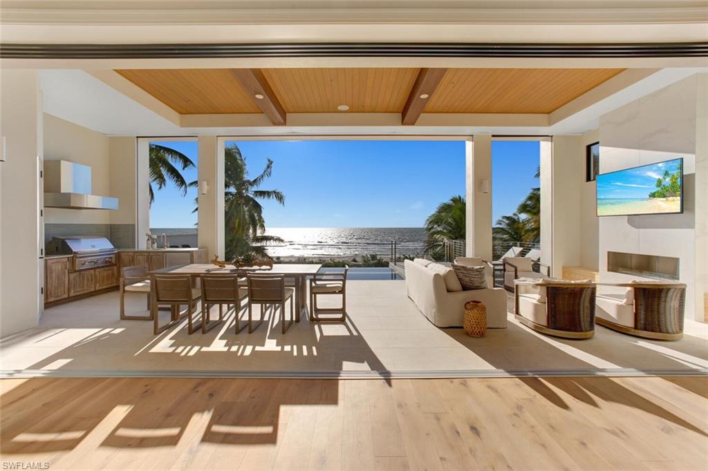 Direct Beachfront, State-of-the-Art, Under Construction residence Expected Completion Fall 2020. A coastal contemporary, modern masterpiece with open floor plan featuring fully pocketing sliders leading to the elevated entertainment deck with infinity pool/spa, outdoor kitchen & fireplace, all overlooking the Gulf of Mexico. Chef’s kitchen features Thermador appliances, stone counters and custom wet bar, perfect for entertaining. Smart-Home technology includes surround sound, automated lighting system, motorized shutters/screens & private elevator. Furnished & professionally designed by area favorite Freestyle Interiors. This spacious custom
home features over 5,500 sq ft of living space with dual master suites, bonus beachfront "cloud room" & 4+ car garage with bonus space for water toys. Built to the newest & most stringent codes by award-winning Potter Homes with concrete block construction & all impact-rated doors/windows. Located minutes to Mercato & North Naples’ amenities, easy access to I75 & the International Airport. This Gulf-front residence encompasses the best of the best; all overlooking the stunning Gulf of Mexico with the sugar sand beach as your backyard.