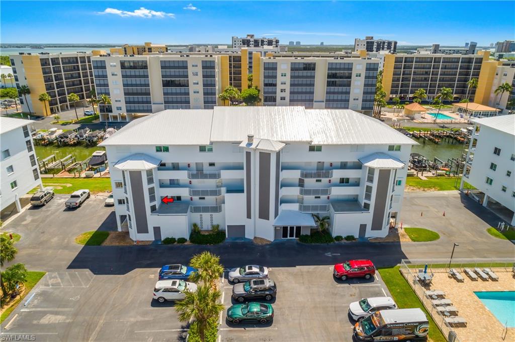 Welcome to this beautifully updated community in Fort Myers Beach. The clubhouse has been refreshed, both pools have been redone, the buildings feature new roofs and fresh exterior paint, and the elevator has been newly enhanced for your convenience.

This desirable end unit offers a split-bedroom floor plan, fresh paint throughout, a modern kitchen, recent updates to the main bathroom, and new carpeting. The balcony lanai features new railings and screens and also includes a washer and dryer for added convenience.

Enjoy your own assigned parking space and dedicated boat slip. Community amenities include pools, tennis, pickleball, a putting green, and shuffleboard. Relax and enjoy all the beauty and lifestyle Fort Myers Beach has to offer.

All assessments have been paid in full.