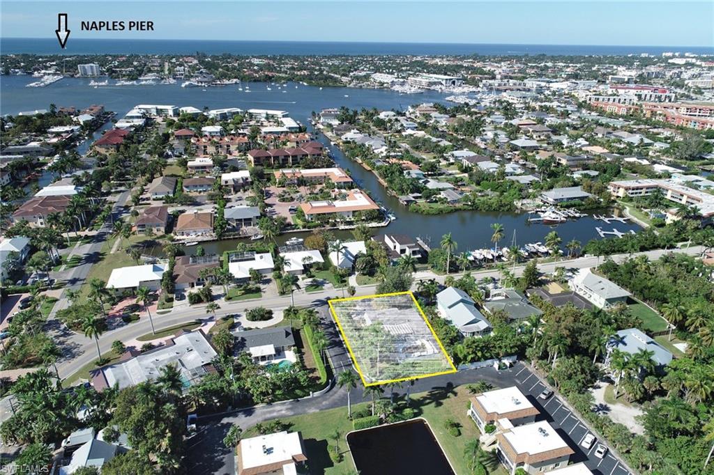 HUGE INVESTMENT OPPORTUNITY!!  Renovate or build! Just around the corner from 5th Ave, Naples Pier, Beaches etc. A chance to reside in a high-end community for half the price. Property is located directly across the street from Sandpiper Marina for Gulf Access. Docks available for rent/purchase. The structure is concrete block construction and has been deemed sound for buyer wishing to renovate. Property being offered "as is with right to inspect".