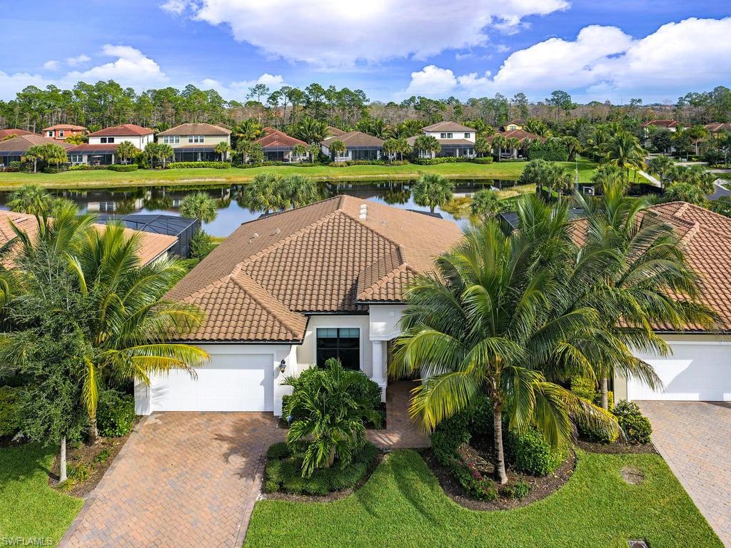 H.15535 - You must see this beautifully appointed WCI Communities home with expansive lake views in the very desirable area of Naples. The spacious pool /spa and lanai,  along with the open concept living area make this home perfect for all your entertaining needs.  Volume ceilings, granite throughout, crown molding, tall baseboards and top of the line flooring tile are just a few of the high end finishes that make this home stunning and move in ready. The great working kitchen features an island, custom tile back splash, stainless steel appliances and wood cabinets. The split bedroom floor plan affords privacy for you and your guests. Ceiling fans in every room and a Kinetico whole house clean water system & reverse osmosis system are a plus! Impact windows and doors cover all your storm safety needs. The attention to detail in this house is nothing less than perfection!  Community amenities include sports court, resort style community pool and spa, tot lot, exercise room and community room. Come see this house to live the Naples lifestyle now!!!