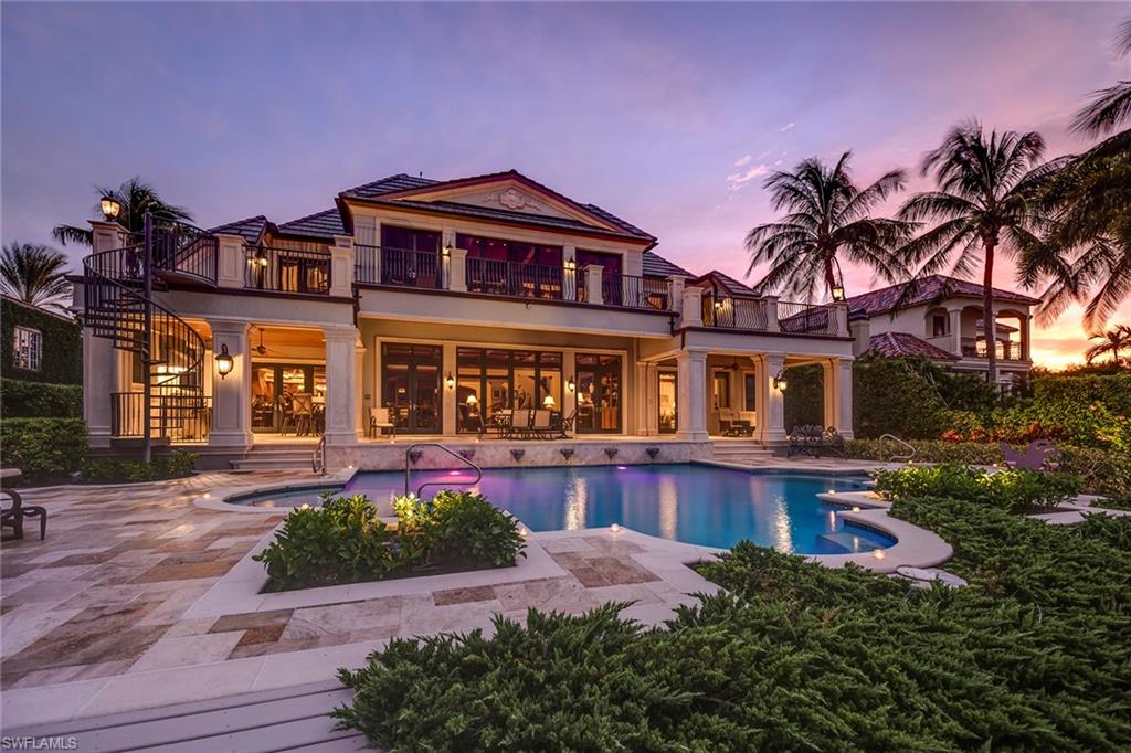 Looking for more living space in a beautiful and safe community with spectacular weather?  Presenting one of Naples most well-built luxury waterfront estates. Masterfully constructed by Kurtz Builders, this custom-built spectacular home sits on Port Royal's most beautiful tree-lined street and offers an incredible combination of the highest quality construction, ample living space for friends and family, and stunning views across Naples Bay. A grand double height entrance opens to over 10,000 square feet of air-conditioned luxury, showcasing coffered volume ceilings, marble floors and intricate hand-crafted millwork. Formal living room, dining room, great room, club room and full bar create gracious entertaining spaces. Well-appointed kitchen features custom cabinetry, top-of-the-line chef’s appliances, and hand-selected natural stone. 6 bedrooms, 6 full baths, 4 half baths, and separate guest quarters provide luxury and privacy. Integrated sound and lighting system, 12-seat home theater, and private elevator. A waterside heated pool and spa, two boat lifts, and a 3-bay garage complete this truly unique property. Port Royal Club eligibility. Offered furnished. Immediate occupancy!