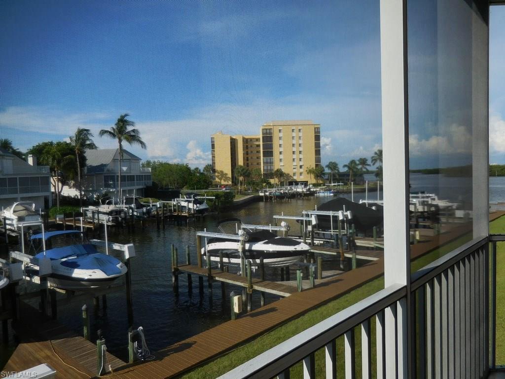 Enjoy main channel and Estero Bay views from this 1200+ sq. ft., partially furnished, 2BR/2BA Casa Marina CORNER unit. This is a very clean, well maintained corner unit, with a split bedroom layout, large living and dining area. Kitchen updates include counter tops, tiled backsplash, cabinets, newer appliances, convection oven and tray ceiling. New water heater 2016. There's also a convenient breakfast bar.  The living area and bedrooms are carpeted. The owner's bedroom is en-suite with a large separate shower and a big walk-in closet. The guest bedroom also has a walk-in closet. The lanai is large, running the length of the unit, offering direct access from the living area as well as from the owner's suite. The washer and dryer are conveniently located on the lanai. Casa Marina is located at the quiet south end of Fort Myers Beach with amenities that include a large pool, tennis courts and fishing pier. The community is also within easy walking distance to deeded beach access, shopping, restaurants and marina. Gulf access boat docks are available.  With main channel views, this unit's lanai is the perfect spot to watch for dolphins, manatees and just enjoy waterfront living!