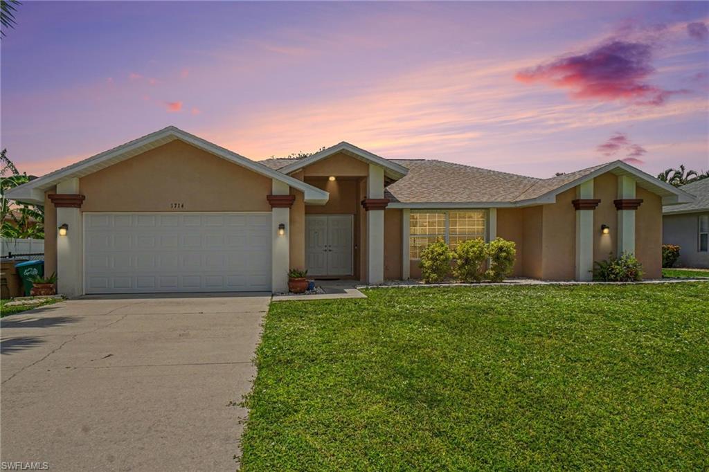 Unlock the potential of this spacious pool home in sunny Cape Coral, offering an exceptional opportunity to create a personalized retreat tailored to your style and vision. Several major updates have already been completed, including a 3-year-old roof, NEW air-conditioning system, and NEW water heater, allowing the next owner to focus on modernizing the interior to reflect their own style and preferences. Designed with flexibility in mind, the thoughtfully arranged floor plan features two separate living areas, two dining spaces flanking the kitchen, soaring vaulted ceilings, and an open flow that adapts effortlessly to everyday living, entertaining, or multi-generational needs. The expansive screened lanai extends the living space outdoors, complete with an in-ground pool, spillover spa, convenient pool bath, and plenty of covered seating areas for relaxing or entertaining year-round. Beyond the lanai, a spacious, fully fenced backyard provides room for pets, play, gardening, or future outdoor enhancements. Ideally located near shopping, dining, schools, parks, and Cape Coral's many recreational amenities, this property presents an outstanding opportunity for homeowners, investors, or anyone seeking a home with generous square footage, versatile living spaces, and endless potential. Bring your imagination and transform this well-designed home into something truly special.