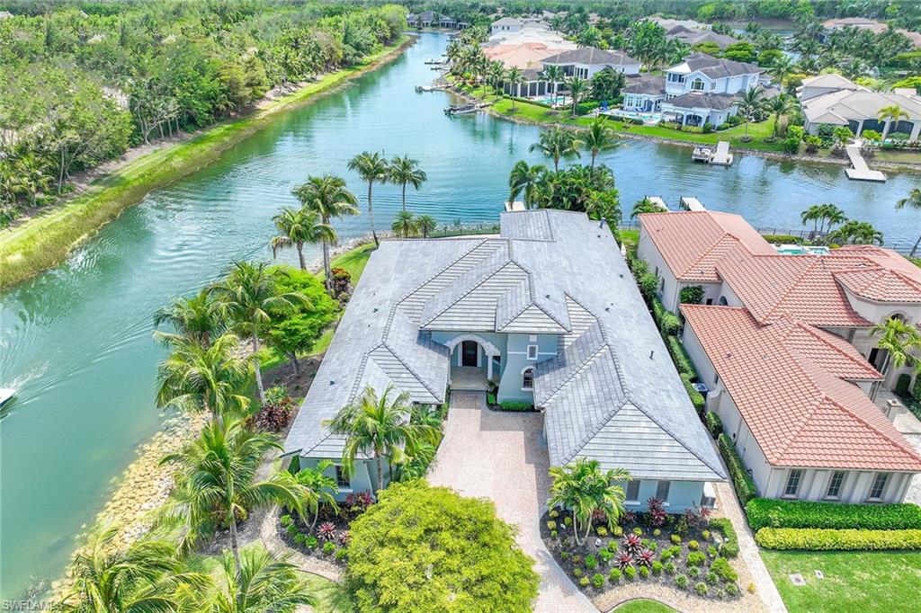 Welcome to the truly unique community of Miromar Lakes, with a lifestyle like no other. This impressive 4,308 square foot residence boasts a total of three bedrooms, three full and two half baths, a library/office, and a separate Casita consisting of a bedroom, full bath, and a breakfast bar with a sink, refrigerator, and built-in coffee maker, for a total of four bedrooms and four full baths. Built with meticulous attention to detail, every corner of this home is a testament to refined elegance, featuring a double-island kitchen with Wolf and Sub-Zero appliances. There is also a centrally located wet bar that is ideal for hosting family gatherings or entertaining guests. The true star of this home is the lanai and pool deck that overlooks two canals and a private dock. This home has too many attributes to list here and must be seen to appreciate. New roof in 2023, air conditioners replaced five years ago, whole house generator, water filtration, and on-demand hot water.
