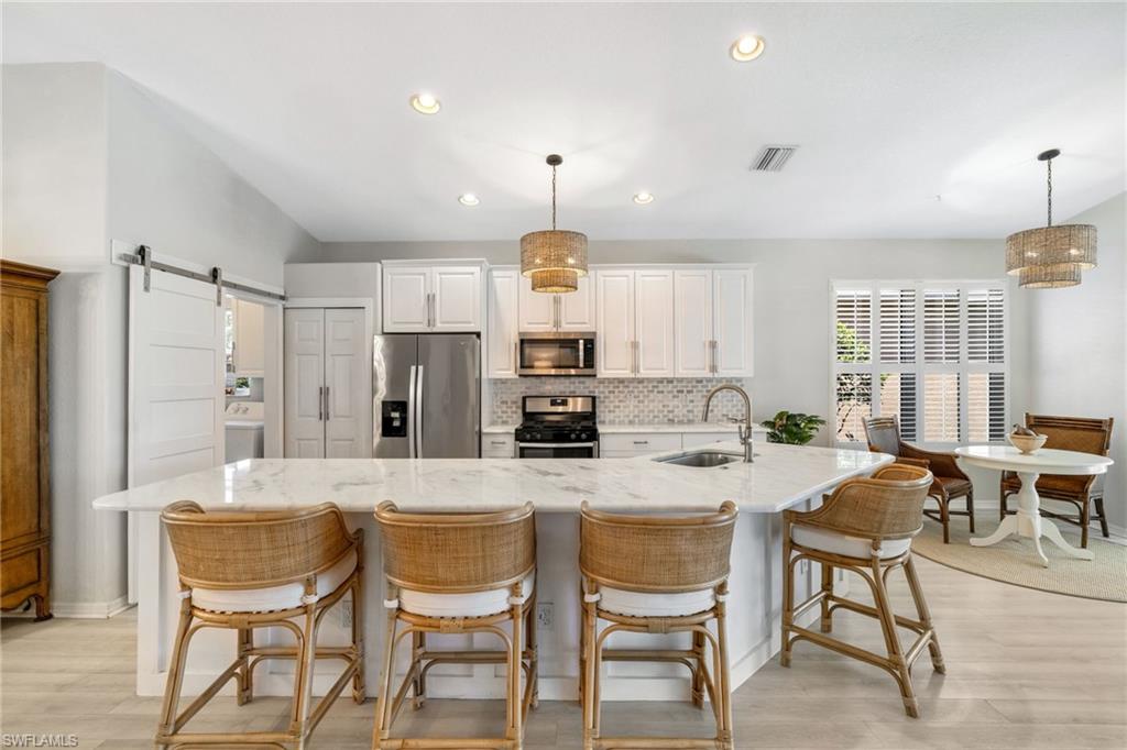 THIS MIROMAR LAKES POOL HOME HAS BEEN COMPLETELY REBORN! Refreshed from top to bottom with beautiful new finishes and furnishings, this stunning residence is ready to impress. **AVAILABLE ANNUALLY FOR $4,900/MONTH!**

Experience the pinnacle of upscale living in this beautifully refreshed single-family home located within the sought-after Miromar Lakes Beach & Golf Club community. This immaculate residence offers 2 bedrooms plus a den and 2 bathrooms and has undergone an impressive makeover with thoughtful upgrades throughout. Enjoy brand-new flooring in both bedrooms (no carpet to be found!), all-new furniture throughout the main living areas, stylish new light fixtures, a beautiful new hurricane-impact front door that creates an inviting first impression, and new hurricane-impact windows throughout the home, providing enhanced storm protection, energy efficiency, and abundant natural light.

Designed for comfortable Florida living, the spacious lanai surrounds your private heated pool, creating the perfect setting for relaxing or entertaining year-round. Offered fully furnished, this home is truly move-in ready. Cable and WiFi are included, adding even more convenience and value.

Residents of Miromar Lakes enjoy an unparalleled resort lifestyle centered around a spectacular 700-acre freshwater lake and three miles of pristine white-sand beaches. Spend your days boating, water skiing, kayaking, paddleboarding, fishing, or simply relaxing along the shoreline while taking in the breathtaking views. The award-winning Beach Club features a stunning resort-style infinity pool overlooking the lake, poolside food and beverage service, a full-service spa, state-of-the-art fitness center, and beautifully appointed indoor and outdoor gathering spaces designed for both relaxation and socializing.

Enjoy waterfront dining at the Blue Water Beach Grill, meet friends for drinks at the outdoor bar, or take advantage of the community's vibrant year-round social calendar filled with events, live entertainment, and activities for every lifestyle. Additional amenities include tennis, pickleball, bocce, basketball, a private movie theater, library, full-service marina, and miles of scenic walking and biking paths. Ideally located just minutes from SWFL International Airport, JetBlue Park, Miromar Outlets, Coconut Point, Gulf Coast Town Center, FGCU, and the beautiful beaches of Fort Myers, Bonita Springs, and Naples, this exceptional home offers the perfect blend of luxury, recreation, and convenience in one of Southwest Florida's premier communities.