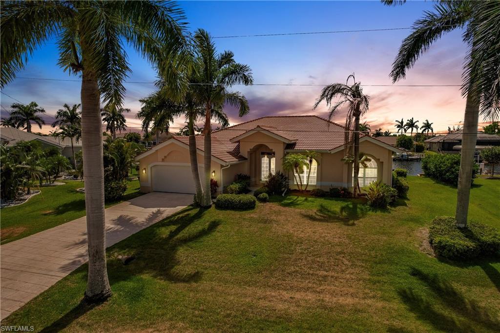 Waterfront Living at an Incredible Value! Discover this well-maintained 3 Bedroom, 2.5 Bath Gulf Access Turnkey Pool Home in one of Cape Coral's most desirable neighborhoods. With assessments paid, major updates already completed, and an unbeatable boating location, this home offers the perfect opportunity to enjoy the Southwest Florida lifestyle today while adding your own personal touches over time.
Boaters will love the Trex dock, boat cover, and tile roof—all replaced in 2023, along with the 10,000-pound boat lift and an approximately 20-minute ride to open water with just one bridge. Conveniently located directly across from the new Sands Park, you'll enjoy easy access to recreation right outside your door.
The open split-bedroom floor plan is designed for comfortable living and effortless entertaining. Pocketing sliding glass doors open the home to an expansive screened lanai featuring a heated saltwater pool with waterfall, a freshly painted pool deck, and an oversized Captain's Walk overlooking the canal.
Additional improvements include new lanai screens, a hot water heater replaced in 2020, A/C replaced in 2021, and a Central Vacuum System.
This is a rare opportunity to own a quality gulf access home in a sought-after location at an attractive price—move in and enjoy it as it is, or customize the interior to reflect your own style and create the waterfront home you've always envisioned.
