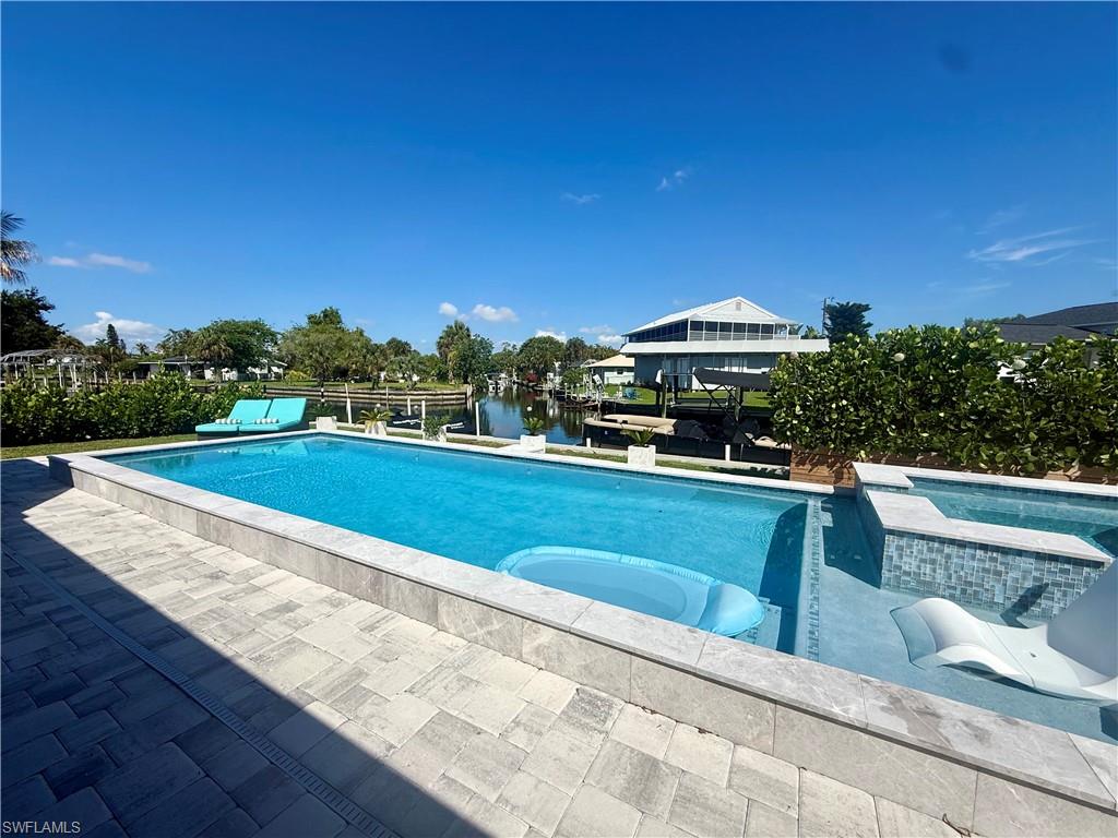 Waterfront Gulf-Access Pool Home – Fully Renovated

Experience the best of Southwest Florida waterfront living in this beautifully updated Gulf-access home situated on a scenic canal. Originally built in 1960, the property underwent a complete renovation in 2022, followed by additional upgrades and improvements in 2024, ensuring modern comfort and peace of mind.

This spacious residence features 3 bedrooms with in-suit bathrooms and walk-in closets, a bright open living area, an updated kitchen, and a 2-car garage. The home is designed for both everyday living and entertaining, with quality finishes and thoughtful updates throughout.
Step outside to your private backyard oasis featuring a nice sized pool with attached spa, electric heated with Wifi control, perfect for relaxing after a day on the water. Boating enthusiasts will appreciate the direct canal frontage with Gulf access, providing convenient access to world-class fishing, beaches, and waterfront destinations.
Additional highlights include a new roof installed in 2022, extensive post-storm renovations, and a move-in-ready condition that combines classic Florida charm with modern upgrades.
Whether you’re looking for a primary residence, vacation retreat, or investment property, this exceptional waterfront home offers the Florida lifestyle you’ve been dreaming of.

3 Bedrooms | 3 Bathrooms | 2-Car Garage | Gulf Access | Pool & Spa | Fully Renovated | New Roof (2022)