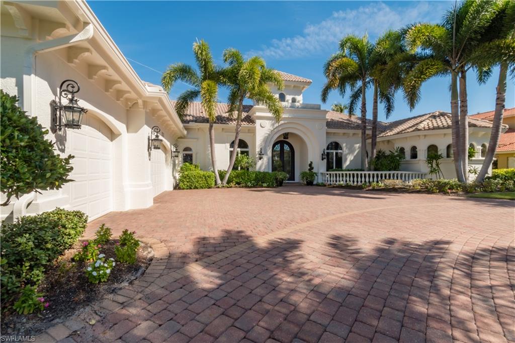 Come see the dramatic transformation of this West Bay estate home, striking from floor to ceiling! Vogue Interiors along with the owners, redesigned and modernized the interior with neutral tones throughout. The floor to ceiling curved glass window gives your first impression of nothing but WATER, GOLF and NATURE views. Located on the newly renovated golf holes #2 & #3. Unique to this home are the Three Master-like ensuites in size. The Master having His & Her water closets & walk-ins with a circular jetted tub, walk-thru shower and unique lighting. There is a linear gas fireplace in living room tiled wall with adjacent walk-thur wet bar. Again, large glass windows to ceiling in breakfast nook and sliders across back of family room with views. Travertine lanai with overflow pool & spa and new picture frame pool cage. 3 car garage with pebble flooring, tankless water system, top of the line appliances, all new flooring throughout, exterior painted in 2019. Everything is Natural Gas; kitchen, pool heater, tankless hot water system, outdoor kitchen and fireplace. Private well for irrigation.
Former Model by Cornerstone Custom Builders. See attached FEATURES for room by room details.