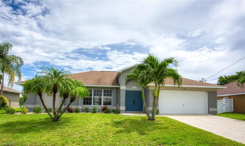 Bring your decerning buying to this imaculant 4 bedroom 2 bath Pool Home with 6 ft Resin white fence surrounding the property located in Sought after SW Cape with city water and sewer.  Spacious under trussed lanai with plenty of room to entertaining, enjoy hanging out at pool and grilling.  Home features Great Room with Vaulted Ceilings that over looks the pool through sliding door,  Kitchen has window that allows natural light, features include Stainless steel dishwasher and refridgerator, pantry and breakfast bar.  Dinning area with sliders leading to the pool, Inside Laundry Room with plenty of room washer and dryer that stays. Split bedroom plan with 3 bedroom and guest bath which also services as a pool bath on one side and a Master Suite with Walk in closet bathroom with Garden Tub and Walk in Shower.