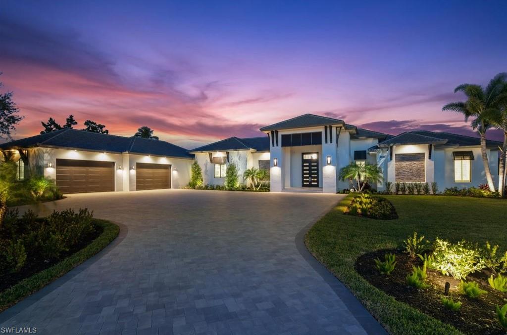 NEW LAKEFRONT CONSTRUCTION IN PINE RIDGE ESTATES! Discover luxurious living at this one-of-a-kind, 1.5 acre estate complete with dock, resort-style pool/spa and putting green! The impressive 5 bedroom + den, 4 & 1/2 bath residence features 5,500 sqft of living space. Four of the bedrooms have their own en-suite bathrooms and the master retreat features a contemporary walk-in shower with multiple shower heads, free-standing soaking tub, dual sinks and dressing area. Modern design and décor can be found throughout the home showcasing floor to ceiling windows, pocketing sliders, impressive wine room and bar as well as a true chef’s kitchen with top of the line appliances. Entertaining is a breeze with expansive outdoor living which encompasses a full kitchen with gas grill, island with bar seating, dining area, and living area with an outdoor fireplace. The Residence is completed with an inviting pool and spa with multiple fire features and endless panoramic lake views. Pine Ridge is a unique community conveniently located just minutes from the Waterside Shops, Ritz Carlton, Mercato and only a short drive to downtown Naples’ white sand beaches, fine dining and world-class shopping.