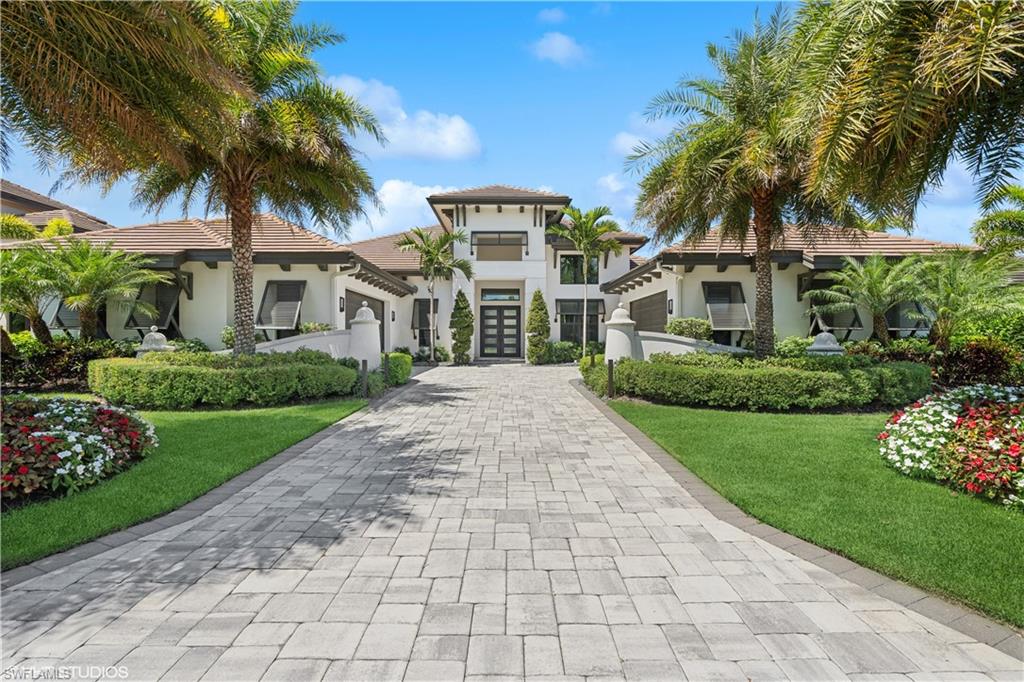 Nestled along the serene shores of pristine lake Como in Miromar Lakes, this prestigious estate home offers an unparalleled blend of luxury, tranquility, and natural beauty. Situated on expansive grounds, this magnificent property boasts breathtaking  views of the glistening waters and lush greenery that surround it.
As you approach the grand entrance, you are greeted by a sweeping driveway lined with lush manicured landscaping, setting the tone for the elegance and sophistication that awaits within. The stately exterior of the home features timeless architectural design, with intricate detailing and custom craftsmanship that exudes refinement and prestige. Step inside, and you are welcomed into a world of luxury living, where every detail has been thoughtfully curated to create an atmosphere of comfort and sophistication. Expansive living spaces are adorned with high ceilings, exquisite finishes, and an abundance of natural light, creating an inviting ambiance that is perfect for both relaxation and entertainment. The heart of the home is the gourmet kitchen, where culinary enthusiasts will delight in the state-of-the-art appliances, custom cabinetry, and expansive island that make meal preparation a true pleasure. Adjacent to the kitchen, the spacious dining area offers breathtaking views of the lake, providing the perfect backdrop for intimate dinners or lavish gatherings with family and friends . The home has 5 areas that can be utilized as bedrooms. 3 are permanent and two equipped as flex space. 3 ensuite baths and a pool bathroom offer great utility. Retreat to the sumptuous master suite, where you can unwind in luxury and comfort after a long day. Featuring a spa-like ensuite bathroom, oversized walk-in closet, high gloss tile with full slab marble shower and matching countertops, all overlooking the water  This master suite is a true sanctuary where you can escape the hustle and bustle of everyday life. Outside, the grounds are an oasis of relaxation and recreation, with lush gardens, a private patio, boast dock and multiple outdoor living spaces that invite you to soak in the natural beauty that surrounds you. Take a dip in the sparkling pool, lounge on the sun-drenched terrace, or enjoy a leisurely boat ride to admire the tranquil beauty of the lake or to the clubhouse for an exquisite meal.
With its unparalleled location, luxurious amenities, and breathtaking views, this lakefront estate home offers a lifestyle of unparalleled luxury and sophistication. Don't miss your chance to make this prestigious property your own and experience the ultimate in waterfront living. Over $600,000 in upgrades: too much to state here, look to the attachment for a complete list. NEW listing, Photographer here on the 23rd, photos to follow. Live the RESORT life!!!!!!!!!