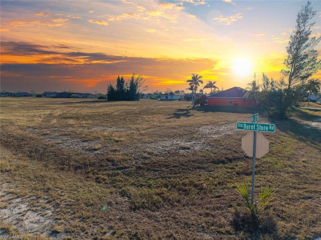 Build your dream home on this corner homesite in the rapidly growing Northwest Cape Coral area. Located just off Old Burnt Store Road, this residential lot offers desirable southern rear exposure, providing excellent sunlight for outdoor living spaces, a future pool, or a backyard retreat. Northwest Cape Coral continues to attract buyers seeking newer homes, larger lots, and room to grow, while still enjoying convenient access to shopping, dining, schools, and everyday amenities along the Pine Island Road corridor. The property is also positioned near the future Seven Islands development, an exciting planned waterfront destination expected to bring additional recreational, dining, and commercial opportunities to the area. Whether you are ready to build now or looking for a smart long-term investment, this well-positioned lot offers an affordable opportunity to secure your place in one of Cape Coral's most promising growth corridors. Optional floor plans are available through a local builder to help bring your vision to life.