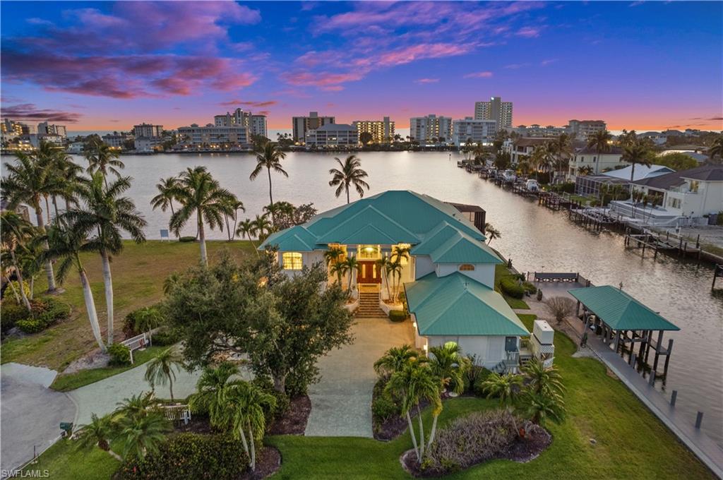 A Rare Investment Opportunity in one of Naples’ Most Sought After Waterfront Communities.

Where the beauty of Vanderbilt Bay meets boundless possibility, discover a property unlike any other in Conners. Spanning over .58 acres on a rare corner tip lot with more than 300 feet of pristine bay frontage, this extraordinary offering presents the chance to create something truly remarkable.

Here, western exposure sunsets melt into the water, boats drift by in the golden light, and every view feels like a postcard. But beyond its beauty lies extraordinary investment potential—the opportunity to design a grand 11,000+ sq/ft waterfront estate, divide the parcel for dual residences, or reimagine the current home while planning your next masterpiece.

A new seawall and dock (2019), along with a rare covered boathouse and sun deck, ensure this property is ready to enjoy today while holding immense value for tomorrow. Just two miles to the Gulf of Mexico via Wiggins Pass, the location offers seamless access for boaters and unbeatable proximity to Vanderbilt Beach, the Ritz-Carlton Resorts, LaPlaya, Mercato, and Naples’ finest dining and shopping.

For the visionary investor or homeowner who understands that opportunity and beauty seldom converge—this is your moment.

Endless views. Endless potential. Endless Naples waterfront lifestyle.