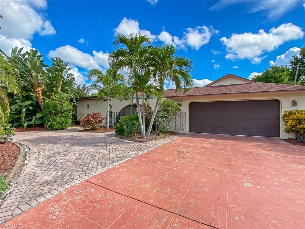 Beautiful Hacienda style 3 bedroom two bath direct Gulf access home with sunroom overlooking your own salt water pool, boat and gardens. This well maintained home is located in the Yacht Club district and near all downtown Cape Coral activities. The front of the house has a small lanai with an active water feature and shade.  This home is surrounded by well maintained gardens for your viewing pleasure and the U shaped driveway in front of the home offers you abundant guest parking. In the back of the home is an air conditioned artist studio that could also be used for storing your boating accessories and an outdoor shower. Roof was replace in 04.
Seller is providing the new owner with 1 year Home Tech home warranty. Pride of Ownership is very clear at this home.