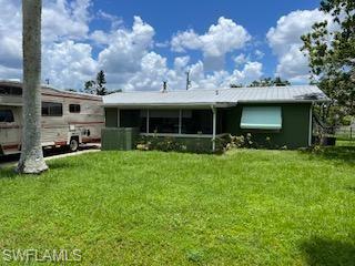 Calling all boaters and fishermen.  If you are looking for a home with easy access to the waters of Charlotte Harbor, Pine Island Sound and the Gulf of Mexico, then this unique Bokeelia home is just what the doctor ordered.  This property is located on the north end of Pine Island, just a stones throw from Lavender Landing which is a Lee County owned marina and boat launch ramp.  The home is older but very well built with CBS construction and a metal roof.  The air conditioning is one year old.  The interior has Terrazzo flooring in like new condition and tongue and  groove cypress wall coverings There are two lanai's , one in the rear of the house and one in the front. The oversized lot is fenced with chain link fencing and there is a 10' X 20' storage building with water and electric.  There is ample room for boat and RV parking.