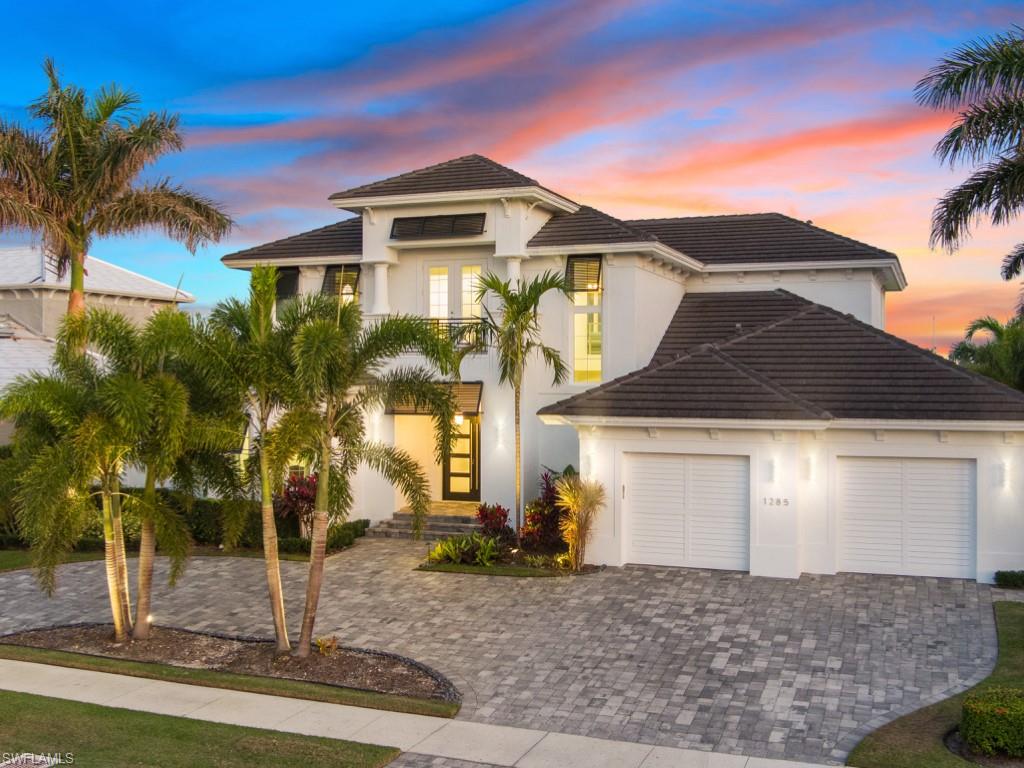 Luxuriate in a perfect piece of paradise! This spectacular coastal contemporary home offers
waterfront life at its finest. Direct access, no bridges and less than 5 minutes to open water!
Water views from every room! This magnificent 2 story freshly updated home offers
WIDE water views, picturesque views of the Yacht Club and Marina, River and Jolley bridge, ideally situated at the beginning of Marco Island. This home boasts 4 bedrooms + Den and 4 bathrooms. The Primary bedroom
is on the first floor and is steps to your spa and pool with expansive outdoor  space and outdoor kitchen. Many upgrades include freshly painted inside and out, all new light fixtures, fenced in backyard, impact resistant doors and windows. Dramatic, open great room with gorgeous water views, perfect for entertaining,
custom kitchen with quartz countertops, new Bosch dishwasher and Wolf stove. Completely New Dock adaptable to accommodate a 90 foot boat with 20,000 pound boat lift, up to 36  foot boat lift, double jet ski platform lift adjacent to pool deck.  This home is sure to be a hit with boating enthusiasts.  Oversized garage including large storage area for all your toys. 2nd floor features huge  Bonus room as well as kitchenette and recreation room for TV enjoyment with 3 spacious  bedrooms all having an en-suite bathroom. Come enjoy this waterfront home with its tranquil water views!