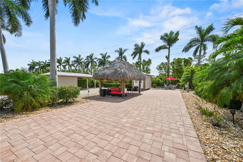 Welcome to Lot 99 in Cypress Trail RV Resort, one of Fort Myers' premier luxury RV destinations. This exceptional 35' x 90' RV lot offers the perfect combination of comfort, convenience, and resort-style living. This lot features a full-sized tiki, creating an ideal space for entertaining family and friends or for staying cool while relaxing in the Florida weather. An air-conditioned private shed/unit with a bathroom adds valuable flexibility and convenience for owners and guests alike. Whether you're seeking a seasonal retreat or full-time home, this lot is ready to enjoy from day one. Cypress Trail RV Resort is renowned for its active lifestyle and impressive amenities, including a resort-style pool with tiki lounge, pickleball, tennis, shuffleboard, bocce ball, fitness center, and clubhouse. Residents also enjoy a scenic lakeside pier and a full calendar of social events and activities throughout the year. Conveniently located near I-75, shopping, dining, and golf courses, Lot 99 offers an outstanding opportunity to experience luxury RV living in Southwest Florida.