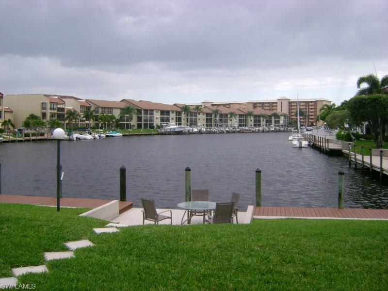 Great location within 1 block of Jaycee Park. Picnic, bike and jogging paths, play area for the grandkids, plus a great view of the river.  Turnkey, sailboat access 1st floor condo with 2 bedrooms and 2 baths, inside laundry, newer air conditioning system, master bath has a walk in closet and the master bedroom has sliders to your own screened lanai overlooking the 200' wide canal with a long, straight view down the canal.  Great place to relax!  Boat dock space is on a 1st come basis and heated brick pavered pool area overlooks the canal.  This condo is super clean and ready for new owners. Schedule your private showing today before this one is gone.