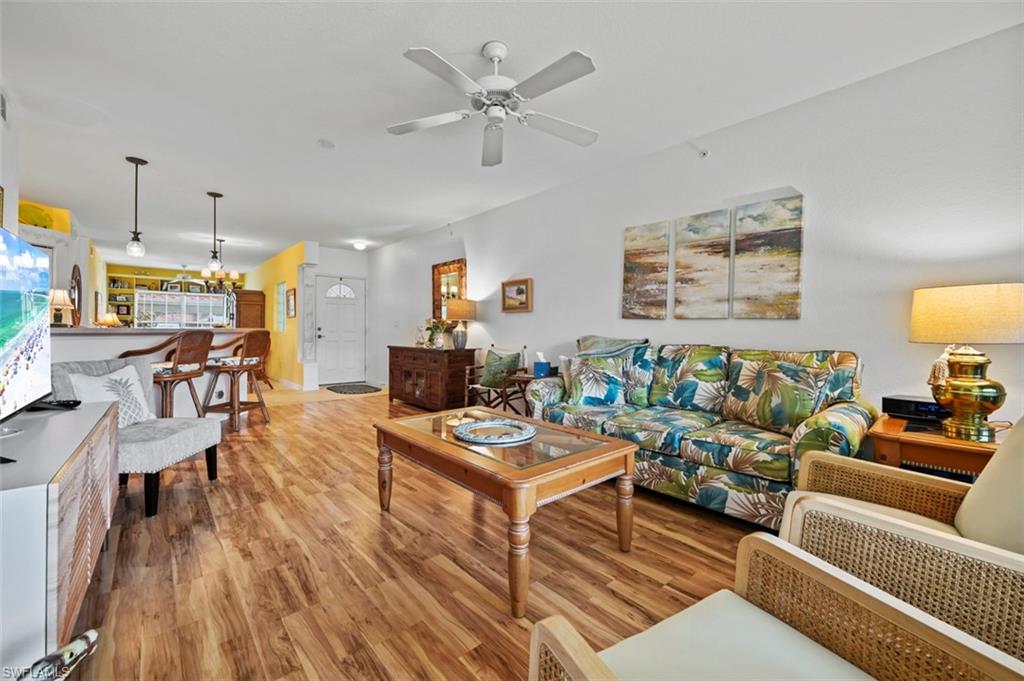 Dreaming of a peaceful first-floor condo with serene lake views? Welcome to this beautifully maintained 2-bedroom, 2-bathroom plus den residence in the highly desirable Lighthouse Bay community. The open-concept floor plan flows effortlessly into a spacious screened lanai, where you can relax while taking in picturesque views of the tranquil lake and fountain—the perfect setting for your morning coffee or evening unwind. Filled with natural light, the bright and airy living, dining, and kitchen areas create an inviting space that's ideal for both everyday living and entertaining. Just off the dining area, the charming morning room features built-in bookcases and abundant natural light, creating the perfect cozy reading nook or flexible sitting area. The spacious primary suite offers a private en-suite bathroom with dual sinks and a walk-in shower, while the second bedroom provides comfortable accommodations for guests or the flexibility to serve as a home office. A den adds even more versatility to the floor plan. Additional features include an in-unit laundry room and ample storage throughout. For added peace of mind, the roofs in Lighthouse Bay were replaced in 2020 with durable stone-coated steel shingles, enhancing the home's long-term reliability. Lighthouse Bay is a gated community offering an exceptional array of resort-style amenities, including five pools (one of which is a lap pool), 2.5 miles of walking and jogging paths, an active bocce program, tennis courts with an on-site pro, pickleball courts, two boat houses, a fitness center, sauna, clubhouse, library, arts and learning center, and so much more. This condo also includes a Bronze Membership to the Brooks Commons Club, featuring a private restaurant, enrichment center, pickleball, numerous social programs, and additional exclusive amenities. . Gold Memberships are available for upgrade, providing access to The Commons Club Private Beach with chaise lounges, umbrellas, an ice/water dispenser, conveniently located restrooms, and Beach Parking Reservations during the construction of the new club. Ideally located just minutes from Coconut Point Mall, exceptional dining, entertainment, Southwest Florida International Airport, and the area's beautiful Gulf beaches, this home offers the perfect combination of comfort, convenience, and the Southwest Florida lifestyle.