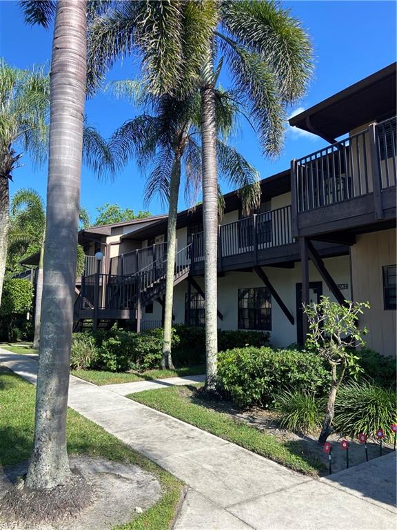 FIRST MONTH'S RENT FREE!  This unfurnished annual is available now.  Nicely updated, light and bright second floor 2-bedroom 2 bath condo located off the East Trail section of Naples in the community of Woodgate. Unit has laminate flooring throughout and tile in the bathrooms. Newer appliances in the galley style kitchen. The great room has a skylight making it light and bright. Community has a community pool and common laundry. Located close to Lely High School as well as Marco Island and all the shopping and dining near 41 and Collier Blvd and also approx. 6.5 miles from 5th Ave S.