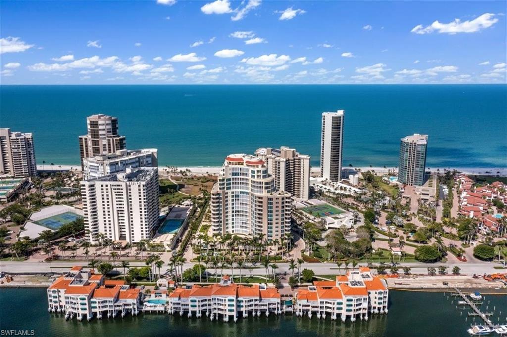 Welcome to Aria, the youngest luxury highrise in the Park Shore neighborhood. Upon entering this exquisite 8th-floor condo, you'll be greeted by the grandeur of a spacious open-concept design that seamlessly melds all the main living areas. Each space maintains its distinct charm while offering breathtaking views of the Gulf, the bay & the city skyline. The interior has undergone a sophisticated makeover, showcasing a modern aesthetic while retaining a warm and inviting atmosphere. Aria stands is one of the select buildings equipped with natural gas cooking, featuring a top-of-the-line Viking Stove, and providing a concierge-level of amenities for its discerning residents.  For added convenience, this unit includes an oversized, air-conditioned storage space, as well as a rare 2.5 car private garage nestled within the community garage. Aria's amenities are second to none, including guest suites, a state-of-the-art fitness center with a spa, an elevated community pool area replete with grills and cabanas that offer spectacular beachfront views. Park Shore itself boasts a unique 2-mile private boardwalk right along the beach, allowing you to experience the epitome of coastal living.