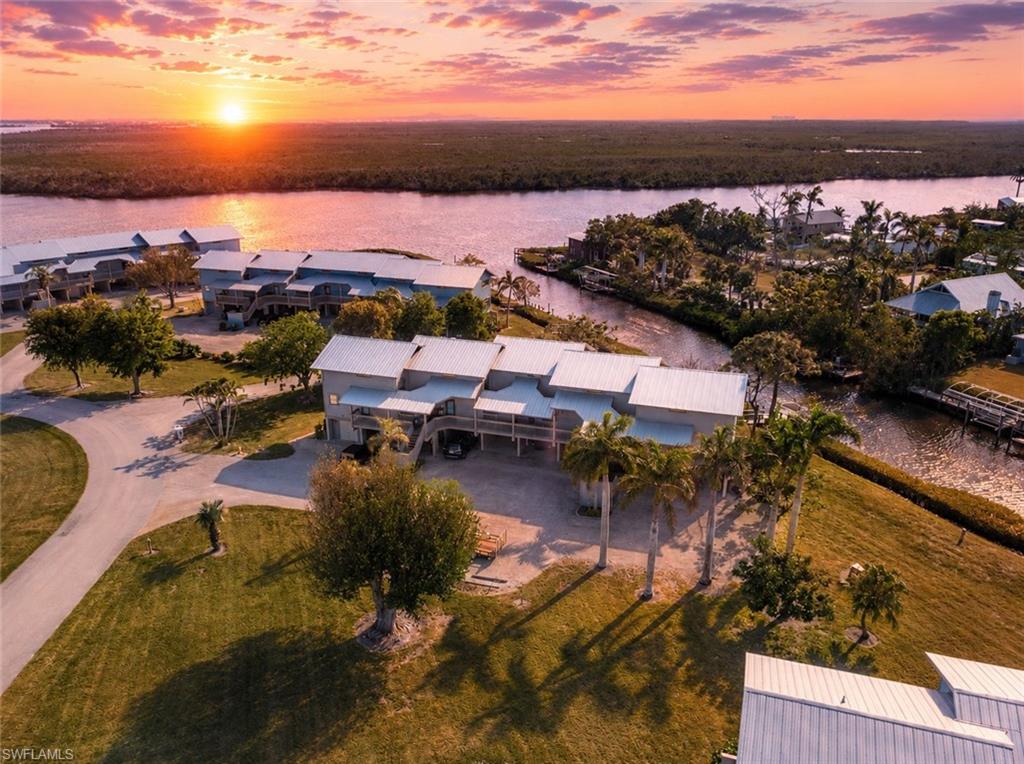 PRICE REDUCTION.  This is a large unit-- 2,162 of living space with two lanai's,double storage area.  You are a quick boat ride to the Pine Island Creek and onward to GREAT FISHING & BEACHES. As you walk in you will view a large open layout for lving area, large kitchen with room for kitchen nook-- dining. An extra room could be for crafts,office a bar etc.. You can change anything within the sheet rock. Two stairways for convenience-two front doors.
The upstairs has three bedrooms and THREE bathrooms. The primary bedroom has two full baths - could be split into two bedrooms or an office with own bathroom.  Lots of closet space. Two other bedrooms at other end have their bath and stairs to that side of Condo.

This unit as a new A/C ,washer/dryer, new metal roof,impact windows.  Two docks for your boat right outside your door.  The buildings at BCK have been newly painted or on schedule. There is a newer private sewer system only for BCK owners.   TWO pools and spas, clubhouse, tennis and pickle ball courts. Plenty of room for walking and biking. Private drive. Included in your HOA is a boat launch and storage for your boat or RV. You can redesign inside your unit to make it "YOURS".  This property is a great buy for family, several couples, investment and can be converted into single units.  Come take a look.












Blue Crab has two large pools, spas, clubhouse, own boat ramp and storage included in your HOA.
This lovely unit has great views of Pine Island Creek and the canal.
This property could be split into two units or any changes inside property is possible - example - the large primary bedroom could be split or added a office with own full bath. The downstairs craft room could be a bar or office.  Lots of possibilites - A great place for several families, couples, investment. Give this serious consideration and call agent or come see.


As you walk in you will view a large open layout for dining, breakfast nook -office/hobby room.
The primary bedroom features two full baths with walk-in showers - large closet.  Two other beds and bath at the far end of the unit with own stairway.
Your HOA insludes many extras - so just come enjoy the beautiful grounds and water adventures.