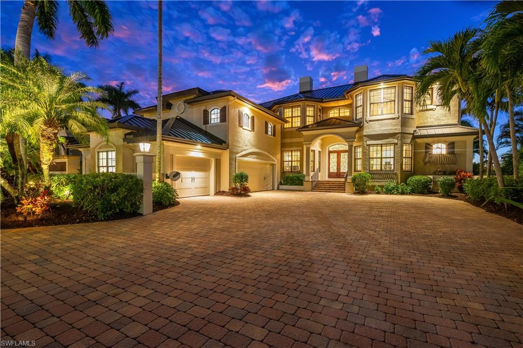 Welcome to 2840 Valencia Way, an extraordinary Caloosahatchee Riverfront estate offering nearly 7,000 square feet of refined living in one of Fort Myers’ most coveted waterfront neighborhoods. Offered fully furnished and professionally decorated, the home is completely move-in ready. This impeccably maintained residence features 4 bedrooms, 4 full bathrooms, 2 half bathrooms, 2 private offices, a game room, full movie theater, gym, and elegant living spaces designed for both everyday comfort and grand entertaining. The first-floor primary suite captures breathtaking river views with great sunset exposure and provides direct access to the pool and spa, creating a truly private retreat. The outdoor living space is exceptional, highlighted by a heated infinity-edge pool, spa, multiple covered entertaining areas, outdoor kitchen, and a well kept backyard leading to the private dock and boat lift—perfect for enjoying life on the river. Commonly, bridge noise on McGregor river front properties is apparent. Not here, your view will be met with a relaxing and serene quietness not found on all other riverfront properties.  Evenings offer some of the best views you could imagine with year-round stunning sunsets. Notable upgrades include a new standing-seam metal roof (2024), impact windows and doors, new insulated garage doors (2025), Sub-Zero refrigerator (2021), Wolf range, dual Monogram dishwashers, and a whole-home WiiM audio system. Upstairs, the game room features a full bar with an ice maker and kegerator, while the dedicated theater delivers a premium cinematic experience with a high-end projector and surround sound system. Ideally located just off of McGregor Boulevard, this premier waterfront enclave offers quick access to Downtown Fort Myers, Sanibel Island, Fort Myers Beach, RSW International Airport, premier shopping and dining, and top-rated schools. 2840 Valencia Way is a rare offering where old-world craftsmanship meets modern luxury, delivering an unmatched riverfront lifestyle.