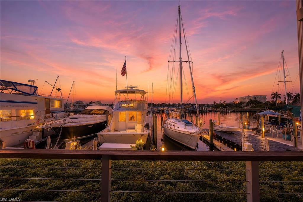 Rarely does an opportunity arise to own a waterfront retreat in the heart of Old Naples with the flexibility to enjoy personally and rent on a nightly, weekly, monthly or seasonal basis. Along Naples Bay at The Cove Inn, this updated residence offers an ideal combination of lifestyle, convenience and income-producing potential. Overlooking the marina and Naples Bay, the property embraces the boating lifestyle that makes Naples so desirable. The adjacent marina offers direct Gulf access, and boat slips may be available for lease or purchase separately, subject to availability. Spend your days on the water, then return home to spectacular sunsets, sparkling bay views and the tranquil sight of yachts cruising through the harbor. Thoughtfully renovated and well maintained, the residence features wood-plank tile flooring throughout, a beautifully updated kitchen and bath, and coastal-inspired finishes highlighted by stunning aqua mother-of-pearl tile accents. Light, bright and move-in ready, the property has been gently enjoyed by its owner and presents in excellent condition. An oversized lounge chair conveniently converts into an additional bed in moments, providing comfortable accommodations for overnight guests. Ownership includes automatic membership to the legendary Chickee Bar, a Naples waterfront institution where residents and guests gather to enjoy tropical cocktails, unforgettable sunsets overlooking the marina. Additional amenities include a large resort-style pool with abundant lounge seating, a recently renovated lobby opening to a sun-filled waterfront patio, and a welcoming fire pit overlooking Naples Bay. From holiday fireworks to the beloved Naples Christmas Boat Parade, the waterfront setting provides a front-row seat to some of Naples cherished traditions. Just moments from Fifth Avenue South, residents can enjoy world-class dining, boutique shopping, art galleries and entertainment less than a half mile away, easily accessed by foot or via the complimentary Cove Inn trolley. Two waterfront seafood restaurants are adjacent to the property, while the popular Cove Inn Coffee Shop offers a place to begin each morning before another day in paradise. Recognizing the value of preparedness in a waterfront setting, the owner has thoughtfully equipped the residence with a storm management package that includes custom Garrison flood planks for the sliding glass doors and advanced reusable water-activated flood control barriers. Designed for quick deployment and convenient storage, these improvements provide an added measure of confidence and will convey with the property. Low quarterly dues even include electric!  Whether you're searching for a seasonal escape, waterfront pied-à-terre, income-producing investment, or a combination of all three, this exceptional residence offers the quintessential Old Naples lifestyle in one of the area's iconic waterfront destinations.