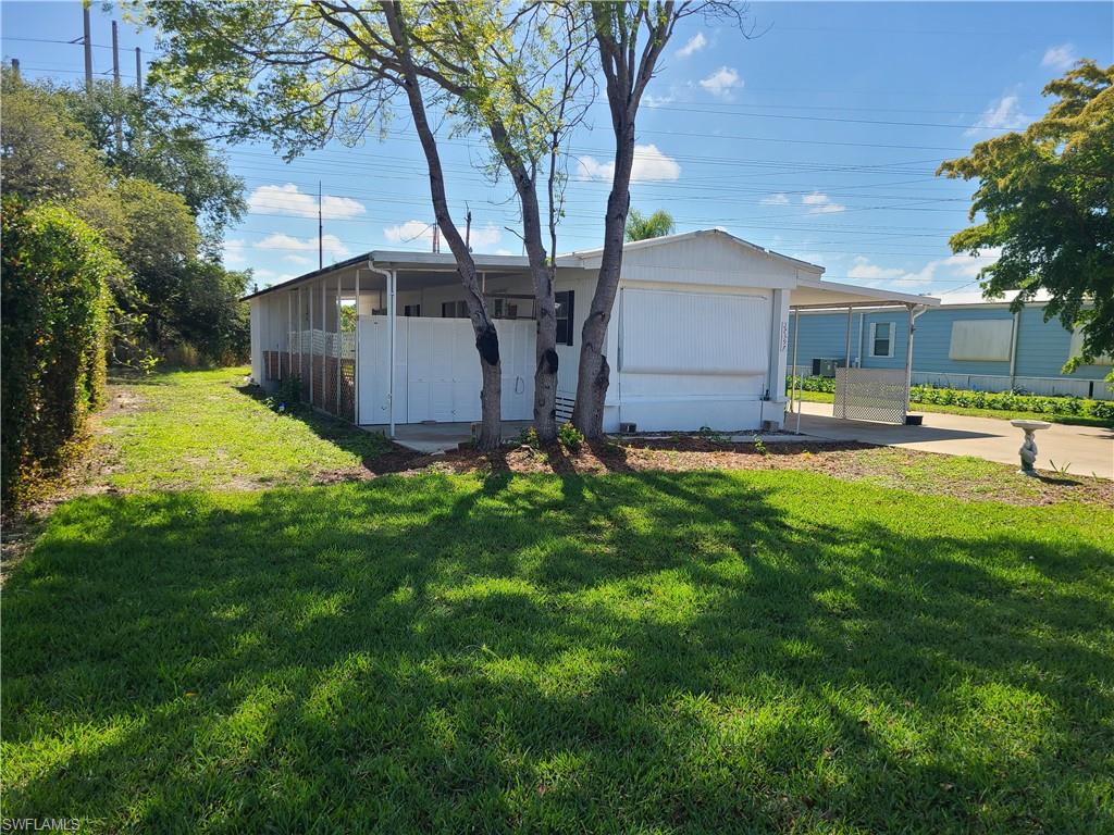 LOWEST priced property in the Village section of Imperial Bonita Estates! OWN your own land in this charming 2-bedroom, 2-bath mobile home located in a 55+ community.  Plenty of room to relax indoor and out. Nice level lot with a brand new irrigation system, 3 work/storage buildings, and plenty of covered parking. Bring your vision and make this home yours. Book your showing today!