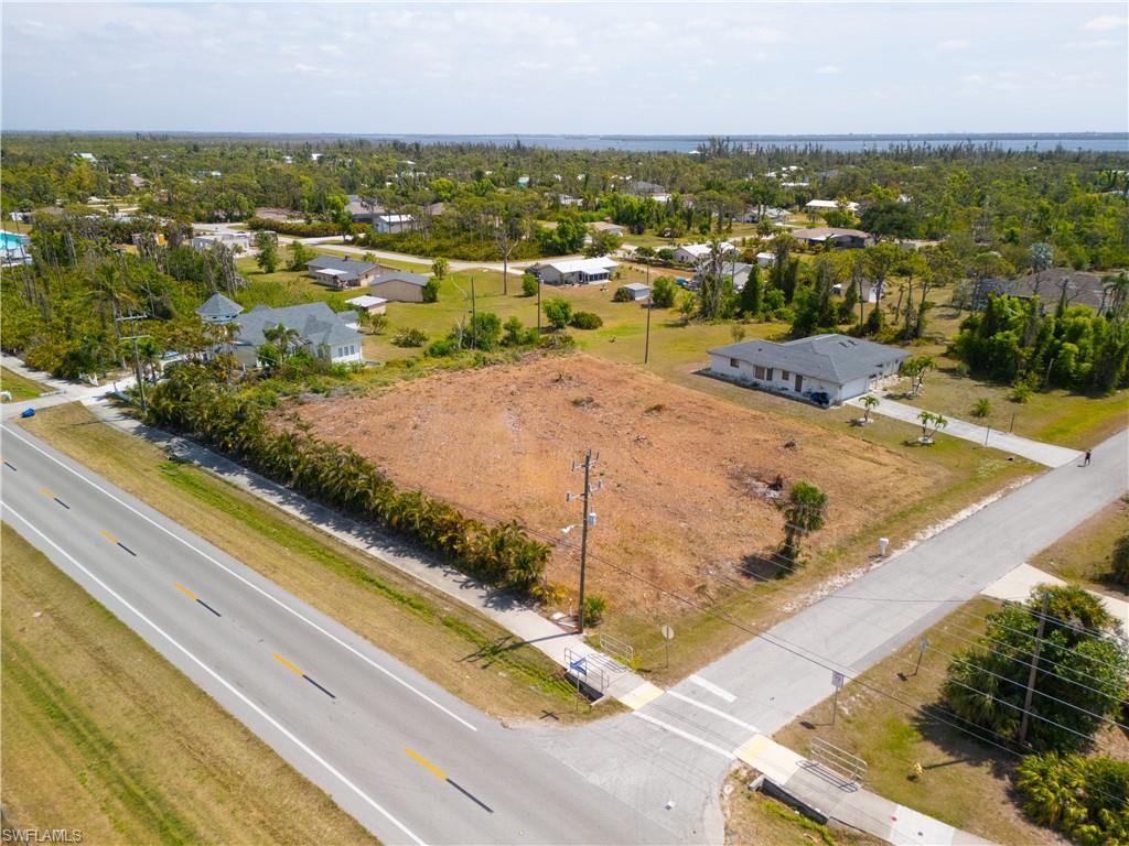 Welcome to beautiful Pine Island Florida! This incredible cleared 3/4 acre + corner lot is the perfect location to build your new home. Tropical Homesites is a quaint and friendly neighborhood where you can take morning or sunset strolls or take your bike out for a spin. Pine Island is SW Florida's largest barrier island with a coastline of mangroves perfect for paddling and fishing and with Pine Island Sound to the west, Charlotte Harbor to the north, and Matlacha Pass to the east, boating and water activities are all around. The Pine Islands Flatwoods Preserve is literally right across the street. There's a 1.5-mile marked hiking trail, as well as more than 6 miles of unmarked fire lines that may be hiked where you can enjoy native plants and wildlife! There's fabulous local dining, and the grocery store is right up the street. Close enough to Cape Coral for added shopping, but quiet for everyday living. Pine Island is the perfect place to call home.